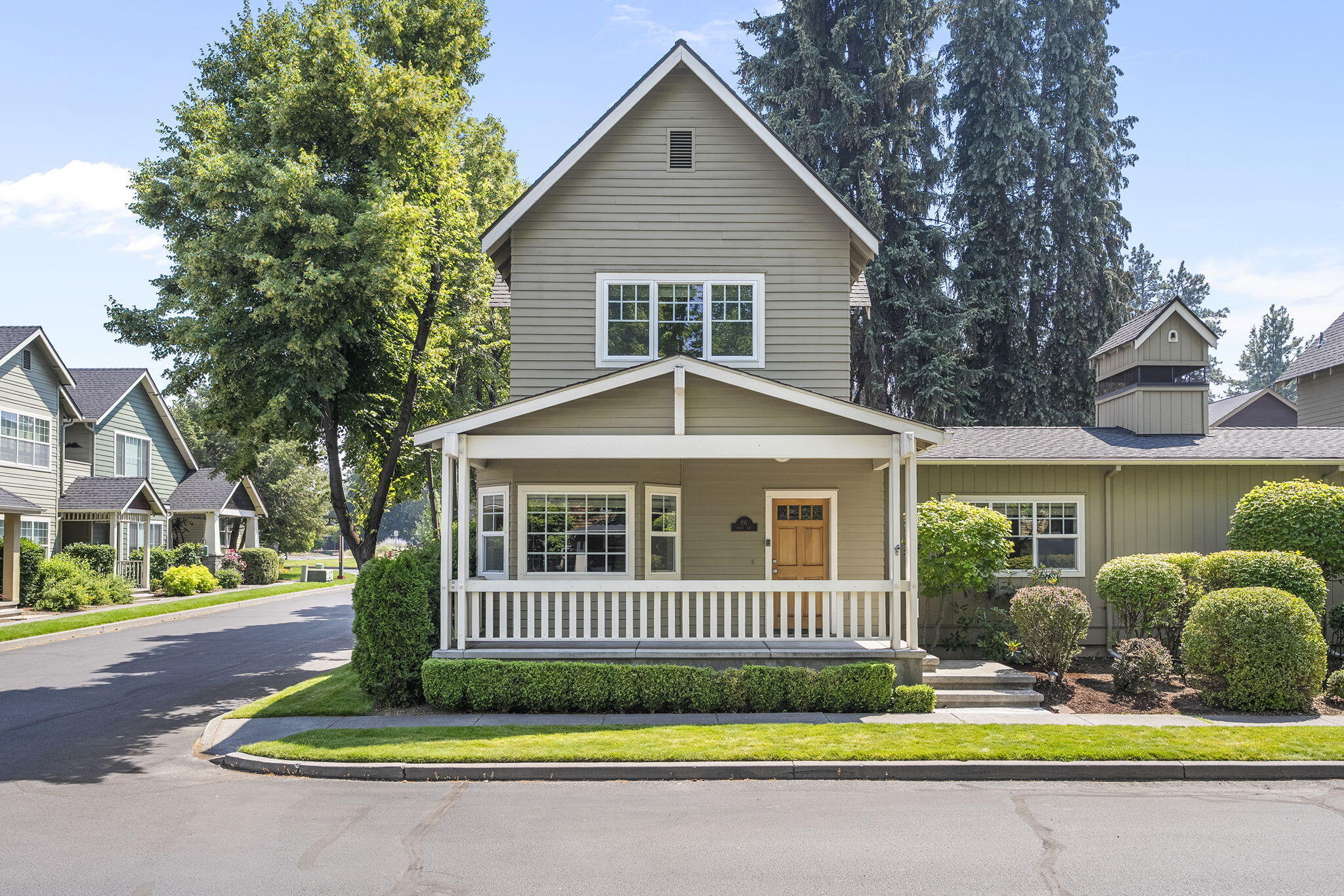 This zero lot line single family craftsman-style home is on a corner lot in the idyllic neighborhood of Village Wiestoria in close-in midtown Bend, perfectly situated between the hospital and downtown.  Recently upgraded with newer engineered hardwood floors, new gas furnace & a/c (2023), new water heater (2025), this high quality home delivers a generously sized primary suite on the main level with spacious walk in closet.  The private, fenced back yard allows for outdoor enjoyment and the front yard landscaping is maintained by the HOA.  Wonderful storage is built-in in the garage.  Village Wiestoria has a community-owned clubhouse for events (see photos) in addition to a guest apartment suite above the clubhouse for guests of the homeowners to reserve and use for a nominal fee.  This is an amazing opportunity to be in a quaint and quiet neighborhood with all the conveniences of midtown Bend.