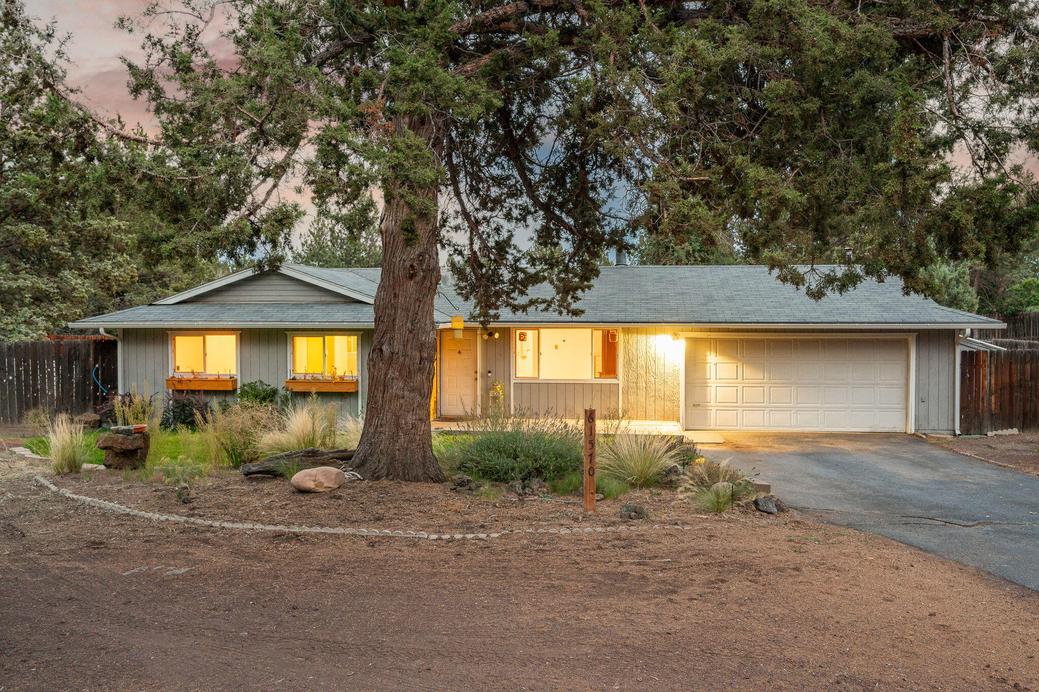 Priced to sell, this single-level home sits on a near-half-acre lot with no HOA and plenty of upside potential. The real value is in the land—room for RV parking, gardening, projects, or future improvements, giving buyers the chance to create the lifestyle they've been looking for. The property already includes lush lawns, planter boxes, and a mature pear tree, along with a powered storage shed featuring a loft and workbench. Inside, you'll find newer laminate flooring, vinyl windows, and a pellet stove with brick surround. The home is move-in ready but primed for updates and sweat equity. Its fully single-level layout offers the possibility of ADA accessibility, with spacious living and dining areas. The garage comes equipped with a built-in dust collection system for projects. Located just minutes from Reed South Plaza for food, drinks, and shopping, this property is a rare chance to add value and make a near-half-acre lot your own.