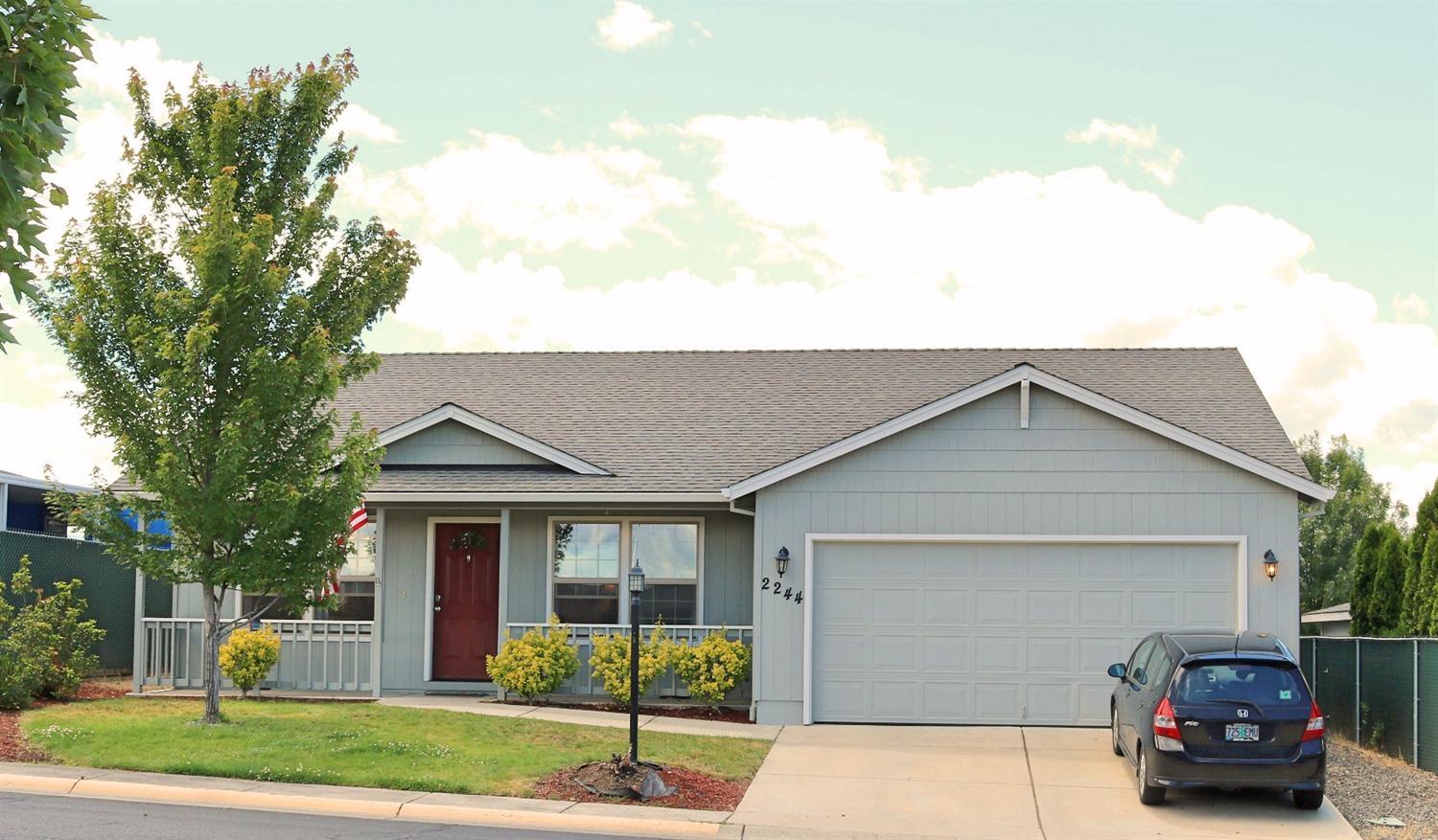 Welcome to this warm, inviting 3 bedroom, 2 bath home in a great neighborhood that is close to everything. This well maintained home is perfect for downsizing or the first-time home buyer. Covered patio extends your living to the outdoors. Home features a large finished 2 car garage. Central Point water park is within walking distance. HOA fees pay for access to the clubhouse, fenced kids play area, and pool. For $10.00 p/month, you can have secured RV parking that is just across the street from this home. Call for an appointment