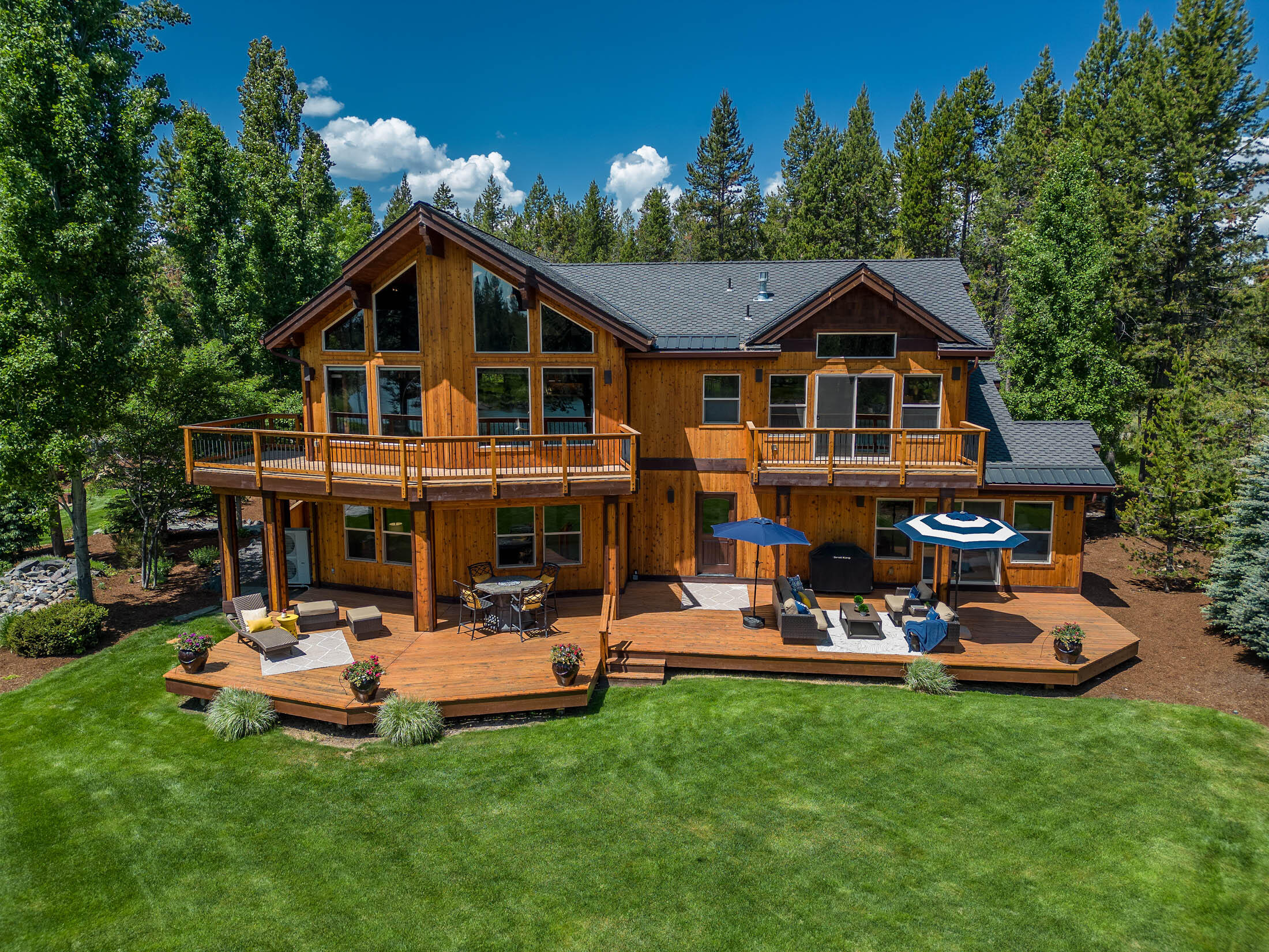 Where the Big Deschutes River and Mt. Bachelor meet, you'll find this stunning luxury home displaying the grandeur and presence of a modern mountain lodge. You'll find yourself surrounded by wildlife and forested terrain paired with unobstructed views that bubble in through the wall of windows and dance off the exposed trusses. The home carries a relaxed sophistication with rustic mountain undertones, appropriate for the grandest of celebrations to the quiet serenity it offers.  Two generous back decks offer the perfect settings to view and soak in the natural beauty. Situated in Central Oregon's best kept secret, River Meadows, you will discover a perfect balance between resort amenities and the local wonders of the Deschutes National Forest.