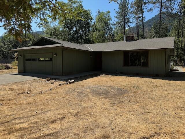 Perfect sized rural ranch with acreage. This 3/2 on just over 2 acres sits just outside of Grants Pass. It features a comfortable 1,782 sq/ft of living space complete with separate living and family room areas. With both fireplace and wood burning stove options. The kitchen has new granite counters with new stainless appliances. There is even a small butlers panty for additional flexibility. An enclosed rear patio allows for year round outside comfort, with additional exterior patio space that is fenced in for security. The property has been fire hardened with overhanging tree limbs removed and an exterior gravel line at the houses edge for additional security. The well is nearly 16 GPM and the septic has been pumped. This one is ready to move in now.