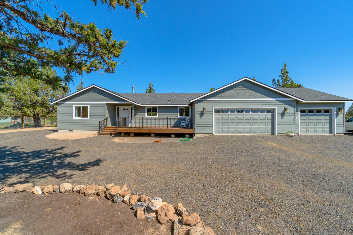 Located in the heart of Central Oregon, this is the perfect property to call home. Custom built in 2016 w/aging in place in mind, this is a must see! Great room style plan w/vaulted ceilings & tons of windows. Modern white kitchen w/slab Granite counter tops, farm sink & SS appliances along w/convenient breakfast bar. New wood burning fireplace in the great room, engineered wood look flooring & carpet inset. Vaulted Master Ste w/ample closet space & bath w/walk in tile shower & soaking tub, dbl sinks & Granite counters. 2 XL guest bedrooms at opposite end of home. Laundry room w/adjacent walk in 2nd pantry/storage closet. Extra wide hall ways & doors, ADA friendly bathrooms & just two steps to the entry. Garage - oversized triple w/space for 3 trucks + all your things! 2 RV hookups (1 at each end of home), lot is level & cleared w/a circular driveway. Expansive treck decks in front & back, complete w/hot tub. Fully fenced & gated entry. Truly a turn key property you won't outgrow!