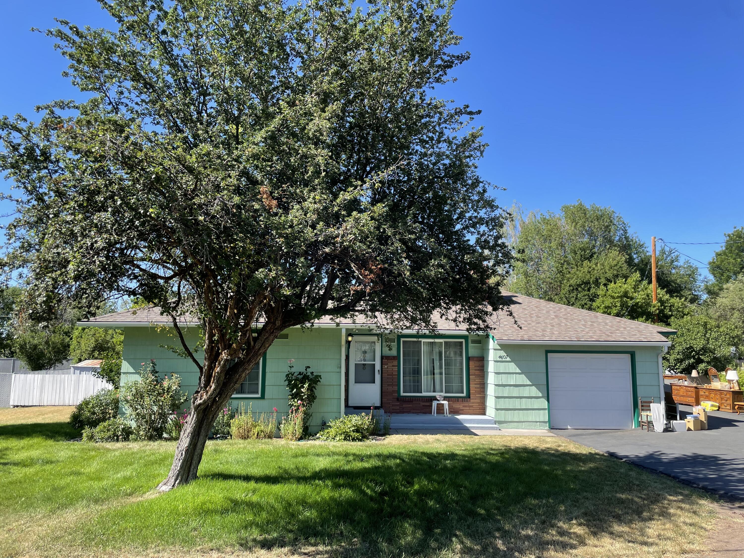 Immaculately maintained home on a large lot in a quiet neighborhood. Hardwood floors, and good carpet in a non-smoking home. Home has large laundry area that includes a room with a toilet in addition to the full bath on the other side of the home. Huge fenced yard great for enjoying the nearly 1/3 acre of in town property. Deep driveway leaves plenty of room for toys or RV.
