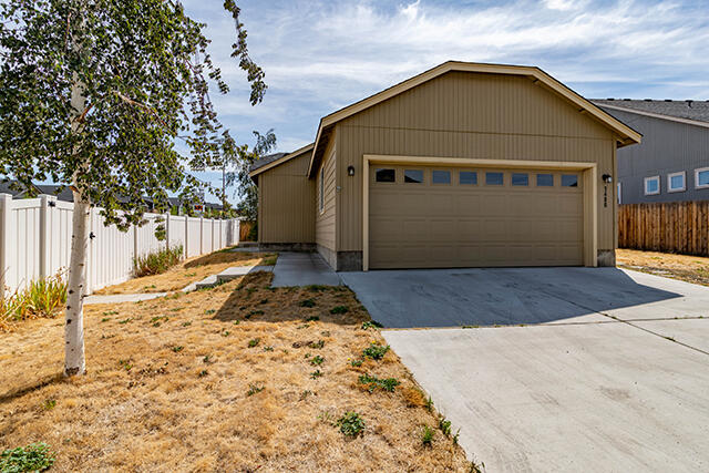 This great little house has tons of potential, with 2 bedrooms, a primary suite with bathroom and walk-in closet, and a second bedroom also with a walk-in closet.  The living room has vaulted ceilings.  There is a 2 car garage with opener and room for additional parking off of the driveway.  There is a nice space for a good sized yard, or garden, or to landscape as you wish.