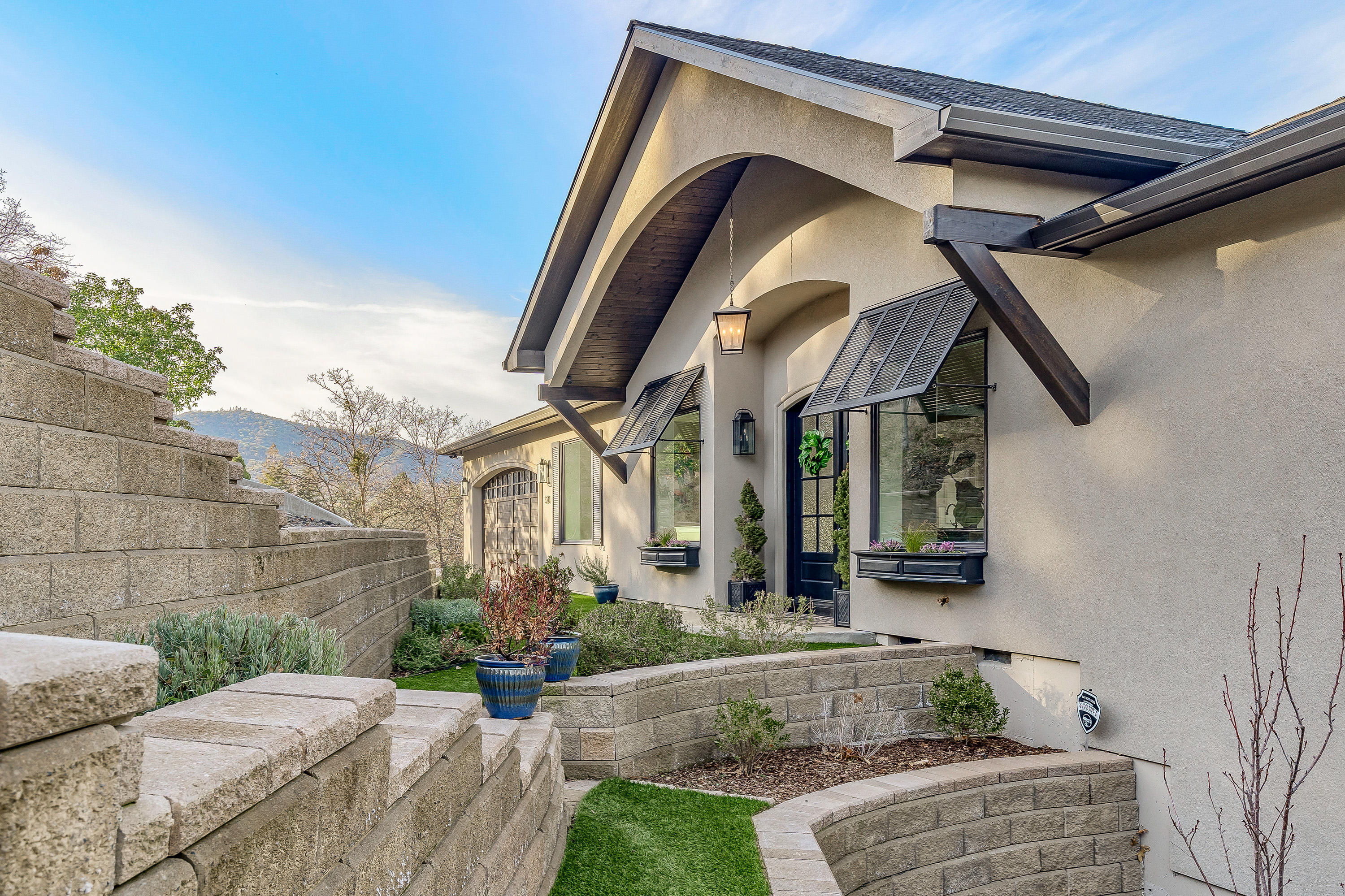 Welcome Home! Completed in 2018, this Clason custom build, offers 180 degree views of Ashland's mountains and valley from virtually every room! No detail spared including 10+' ceilings, 8' solid wood doors, custom cabinetry, Visual Comfort lighting, walk-in closets and crown molding throughout. Chef's kitchen includes a large island, KitchenAid appliances, double ovens, Wolf cooktop, walk-in pantry, and separate bar with wine fridge, storage and ice maker. Open concept Greatroom offers versatile floor plan for relaxed living and dining, vaulted ceiling, stone surround gas fireplace, hardwoods and indoor/outdoor flex-room with gas fireplace & heater. Coupled with the expansive patio and Sonos sound system, this home is an entertainer's dream. Downstairs includes family room and four view-worthy bedrooms including expansive Master suite with spa-like bath; separate shower, soaking tub, dual sinks, and laundry room. Abundant storage throughout, as well as room for addition!