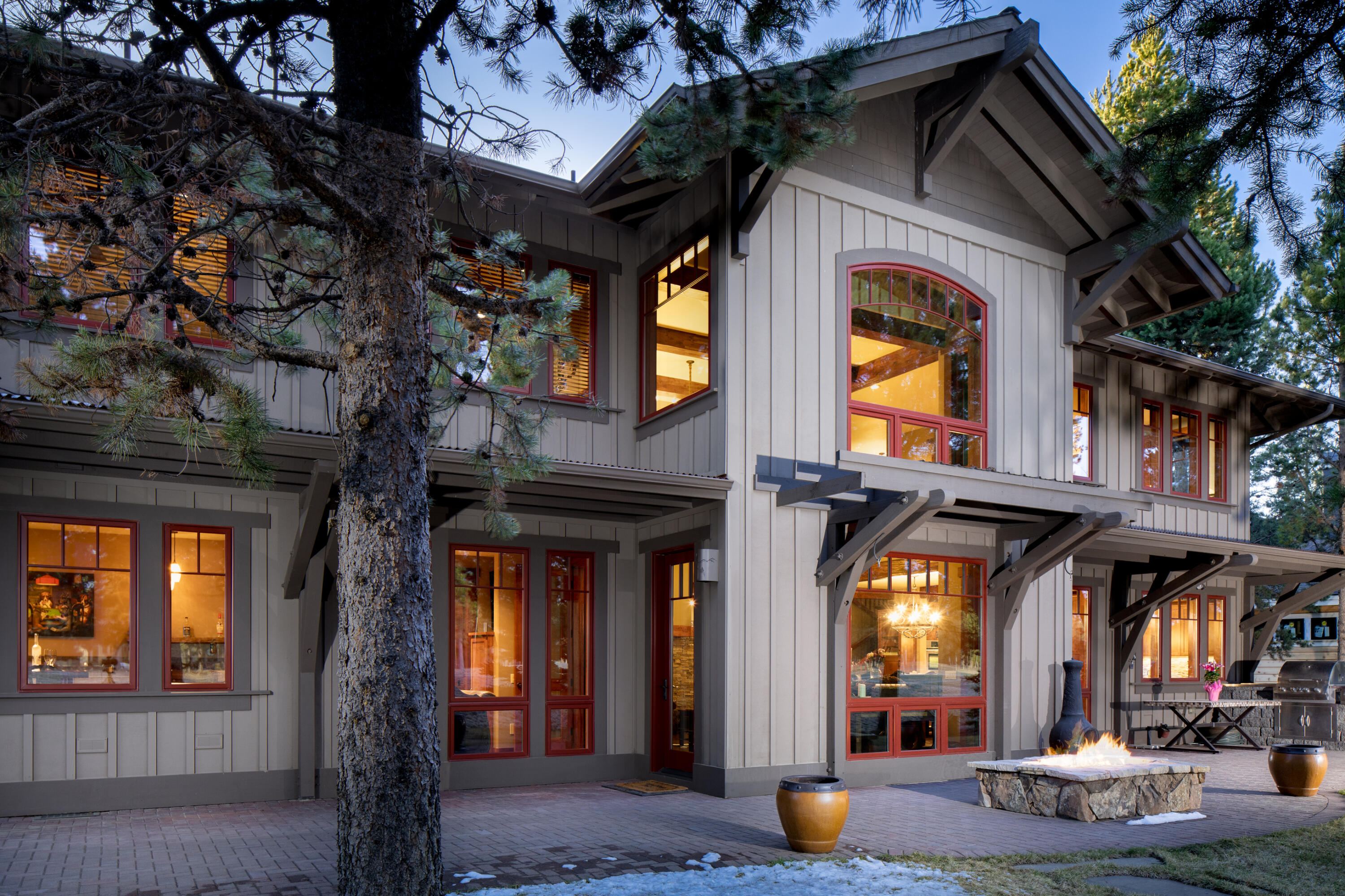 Discover unparalleled craftsmanship in this exceptional Caldera Springs home, where superior quality & attention to detail elevate every aspect of luxurious living. This residence showcases an expertly crafted design, with stunning granite surfaces & rustic exposed wood beams. Upon entering, the grand great room captivates with a soaring stone fireplace and two-story windows framing breathtaking views of the course. The inspired kitchen is both spacious & functional, the pub room is ideal for hosting gatherings. The thoughtful floor plan includes a main-level primary suite with private access to a tranquil saltwater spa. Upstairs, two additional bedrooms & a cozy bunk room with an entertainment area provide ample space for family & guests. The home's striking courtyard entry features a custom metal gate and hand-carved solid wood door. Enjoy sunrises on the back patio, complete with a fire pit & built-in barbecue, the perfect balance of high-quality design & comfort awaits.