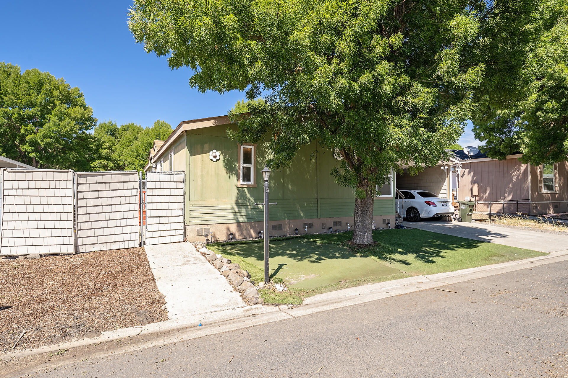 Spacious, Affordable, and Full of Potential!
Welcome to this generously sized 3-bedroom, 2-bath manufactured home located in a well-maintained all-age community that offers fantastic amenities—clubhouse, fitness center, and billiards room all included!

Step inside to an open-concept layout featuring tile flooring, a cozy breakfast nook, and a full-sized dining area perfect for gatherings. The wide carport provides ample parking and includes a convenient storage shed for all your extras.

Whether you're looking for your first home or downsizing with style, this home offers affordability and room to grow. Bring your vision and make it your own!