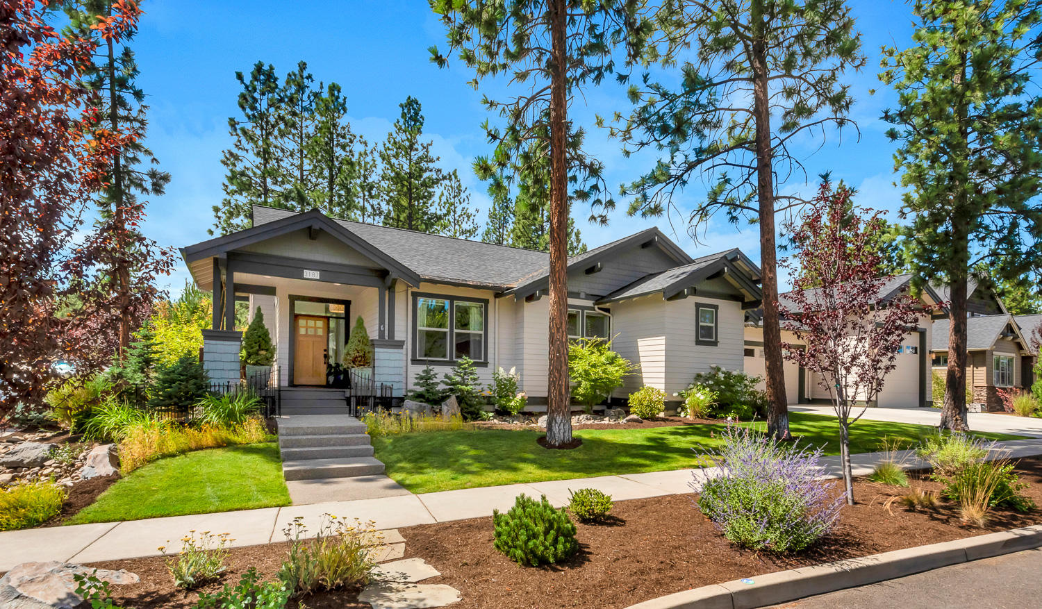 Impeccable Northwest contemporary home in Bend's highly sought after Shevlin Ridge neighborhood. This award-winning 3314 s/f Great room floor plan lives like a single-level, with large bonus room upstairs. Southern exposure creates passive solar and incredible light throughout the day, while tall ceilings and extensive windows bring the outside in. This home flows gracefully through the living, dining and kitchen areas. Large main suite with custom shower, and private patio plus three additional beds and baths all are neatly separated for privacy. Gourmet kitchen complete with 10-foot center island, wet bar, high-end appliances and kitchen sink looking out over the huge backyard. Three-bay garage complete with an 11-foot garage door, workbench, ample storage and room for a small RV. Large park-like corner lot, ideal for outdoor entertaining, gardening or playing on the grassy lawn. Westside school district. Minutes from Shevlin Park and Downtown Bend.
