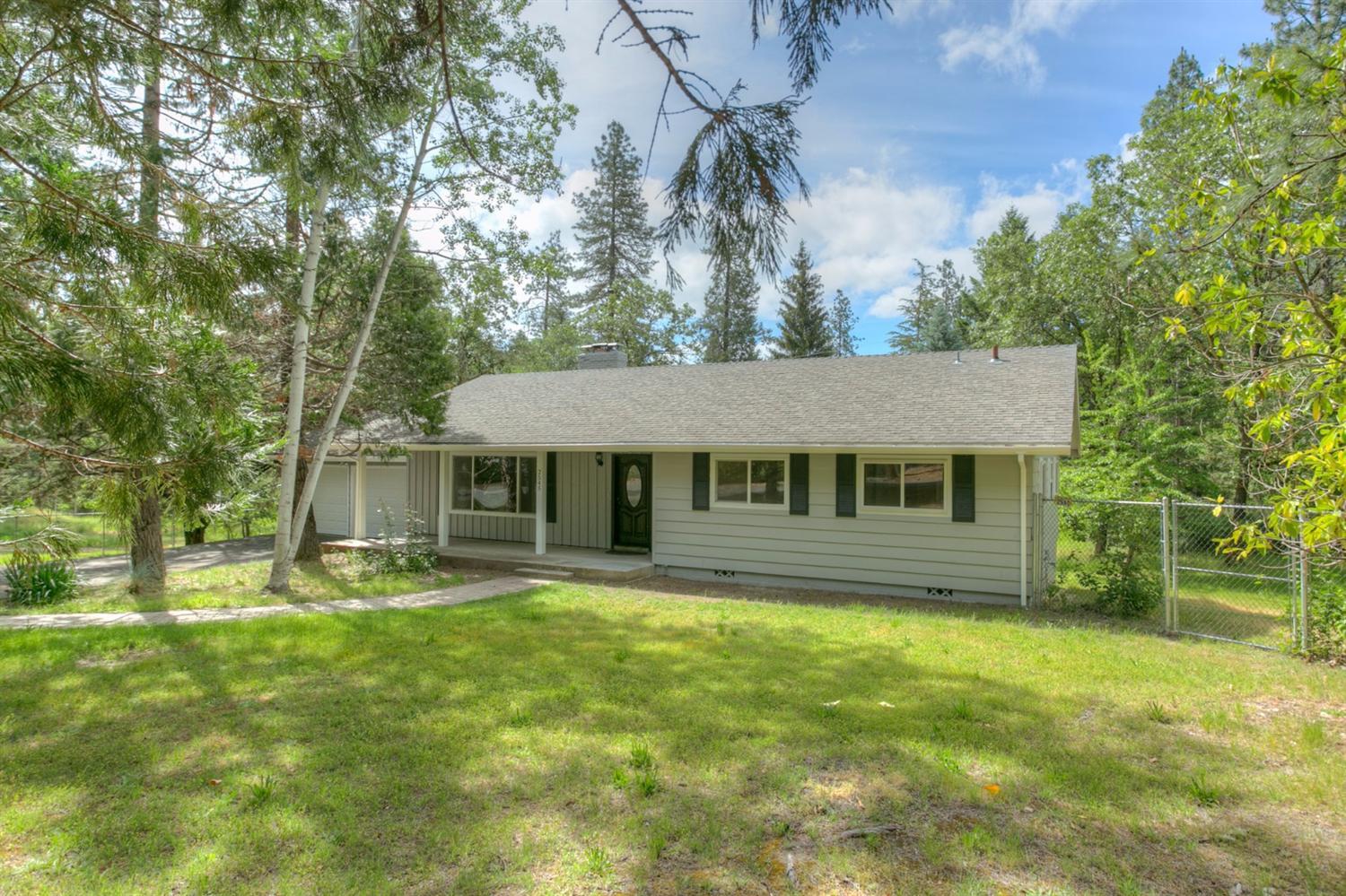 You will enjoy viewing this beautifully remodeled home. Featuring a spacious 4 bedroom, 2 bath home with 2280 sf; and nestled on 1.26 fenced acres. The cook will love this gorgeous sunny and bright kitchen with new stainless steel appliances, granite counters, island, pantry, dining room with slider to the deck. Living room with stacked rock fireplace, wood floors and large entry. Bathrooms have been updated with new vanities, shower and floors. Downstairs is perfect for entertaining family and friends/game room and a large bedroom. A workshop/storage area off family room with own entrance. Room for gardening, paved driveway, RV parking and access through double side gate. Close to town and shopping; low county taxes. You will feel right at home the moment you step into this home. Put this home on your list to show. Home fronts on Peco Drive.
