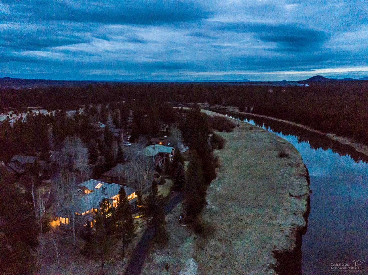 Seize the opportunity!! Rarely listed Skypark home right on the river. NW Contemporary, artfully perched w/west facing decks overlooking the Deschutes & Mt Bachelor. River views from almost every room. Dramatic foyer leads to vaulted great room on main floor; tons of natural light, floor to ceiling windows & spacious layout-an entertainer's dream! Kayaking, rafting & tubing right out the back door. 2 master suites & 3rd BR downstairs. Radiant hydraulic heating, A/C, Nest thermostats & sound throughout.