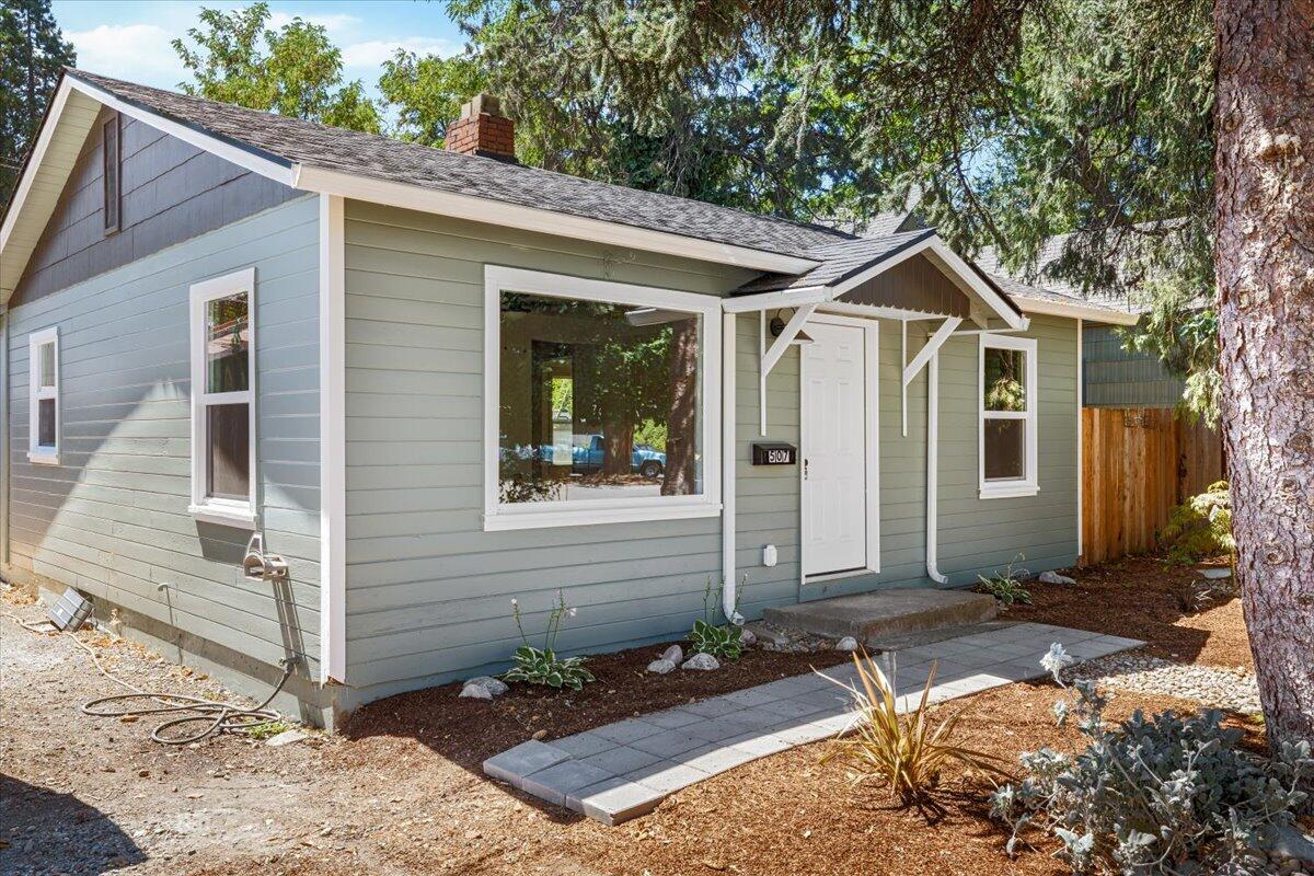 Beautifully Restored Cottage in the Heart of Grants Pass! This charming 2-bedroom, 1-bath home has been thoughtfully updated while maintaining its classic character. Enjoy peace of mind with a new roof, new windows, and a brand-new A/C system. Step inside to find fresh interior and exterior paint, refinished hardwood floors, and a completely updated kitchen featuring new cabinets, countertops, oven/range, and dishwasher. The tiled shower/tub combo, adding a modern touch. Additional upgrades include new fixtures throughout and a restored garage. All the work is done and move-in ready! Located close to shopping, dining, and all that downtown Grants Pass has to offer.