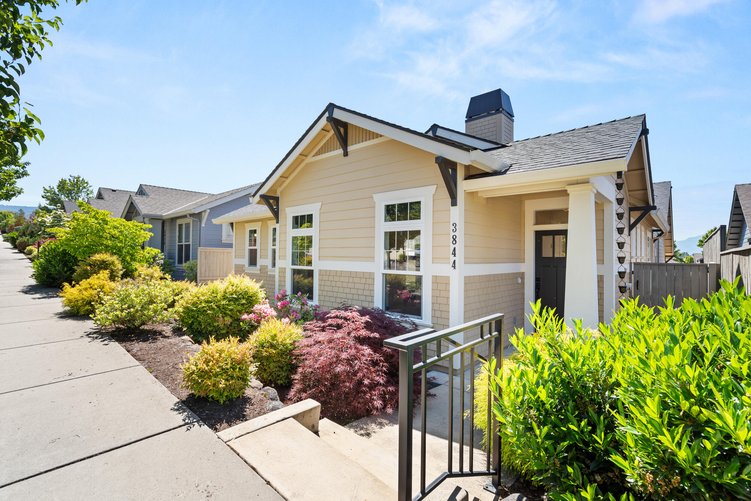 This house comes with a REDUCED RATE as low as 6.375% (APR 6.622%) as of 06/13/2025 through List & Lock™. This single level, split floor-plan, craftsman style Mahar build home invites a lifestyle of both ease and luxury.  Located in the desirable east medford a short distance to Village Center Park. Featuring Tuscany oak hardwood floors and high end cabinets throughout with Brand New Carpet in all the bedrooms. Kitchen consists of caesar stone quartz countertops with tile backsplash, a 6 burner gas stove and newer stainless appliances. Bathrooms have quartz & tile countertops and tiled flooring & showers.  The primary bathroom has an accessible shower, and a nearby large walk-in closet.  The guest bathroom features a shower-bath combo. Dutch doors to the third bedroom open up to the perfect craft-room or office space if needed.  Low maintenance yard with courtyard patio perfect for entertaining. Earth Advantage Platinum certified home. Natural Gas furnace, and fireplace in living room