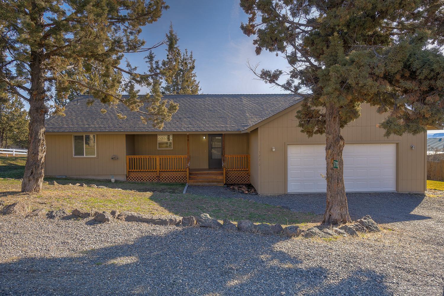 Fresh paint, brand new carpet & ready for NEW Owners! Like new home has an open floor plan w/great Master Ste separation. Central kitchen & living area w/bar seating, tons of counter space & great layout for someone that likes to change up their furniture! Covered front porch for year round enjoyment & grilling. Back deck looks out to the foothills, Double Garage & plenty of RV parking & low maintenance landscaping. Bring your toys & make this property your home!