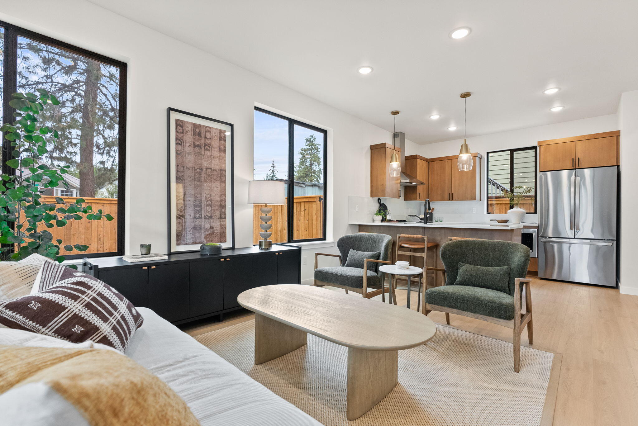 Downtown Bend investment opportunity meets modern mountain living. These newly completed townhomes are designed for your active lifestyle in this charming historic neighborhood. Across the street, enjoy freshly baked sourdough or locally roasted coffee at Jackson's Corner, with the Old Mill, Deschutes River, downtown, and Box Factory just around the corner. This desirable end unit offers two spacious primary suites with private baths, enhanced by a California Closet systems for elevated organization. Private storage shed provides secure space for bikes, skis, and gear, while the spacious, fully fenced, low-maintenance backyard is a rare find in this location. Energy-efficient construction, zoned heating/cooling, and lock-and-leave design ensure ease of ownership. Investors will value the highly rentable location, while second-home buyers will love the lifestyle. With no costly HOA dues and a $10,000 financing incentives, this home is all about quality and value. Make it yours today.