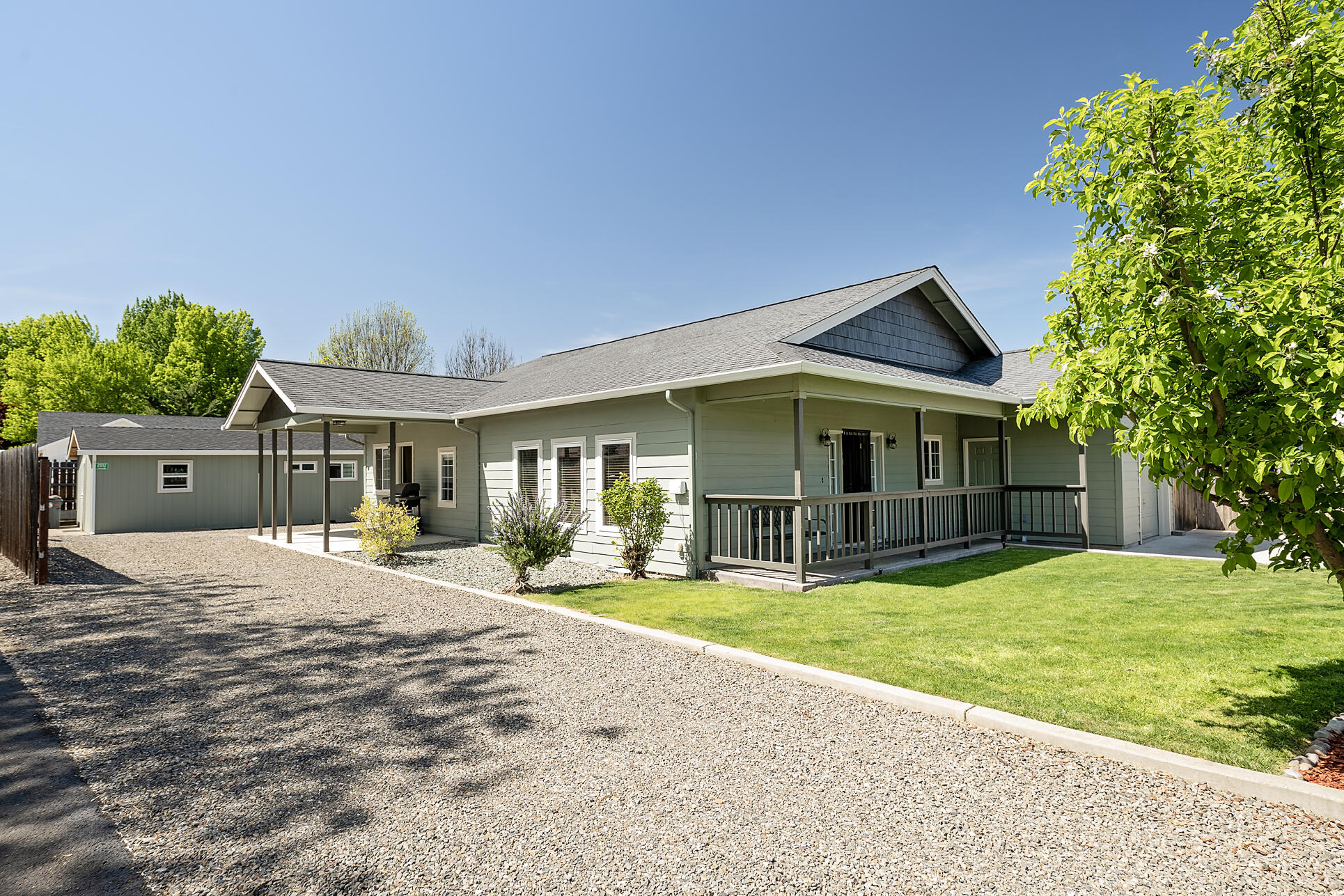 Discover the perfect two-family setup or an exceptional investment property with two houses on one tax lot! The front home boasts 1,674 sq ft of spacious living, featuring 3 bedrooms and 2 baths, two generous living areas, and a dining room that flows seamlessly into the open-concept kitchen with a charming breakfast bar. You'll love the exposed wood vaulted ceilings and rich wood accents throughout, creating a warm and inviting atmosphere. Between the homes there is RV parking with hookups. The back house is a 1 bed, 1 bath suite complete with a bonus sitting room/office and a private patio, perfect for extended family, guests, or tenants. Recent updates include a new roof, updated HVAC system, and several replaced windows. There's even a separate storage structure with plumbing and electrical offering endless possibilities for a studio or workshop. This unique property offers a strong investment potential—don't miss your chance to own this one-of-a-kind opportunity!