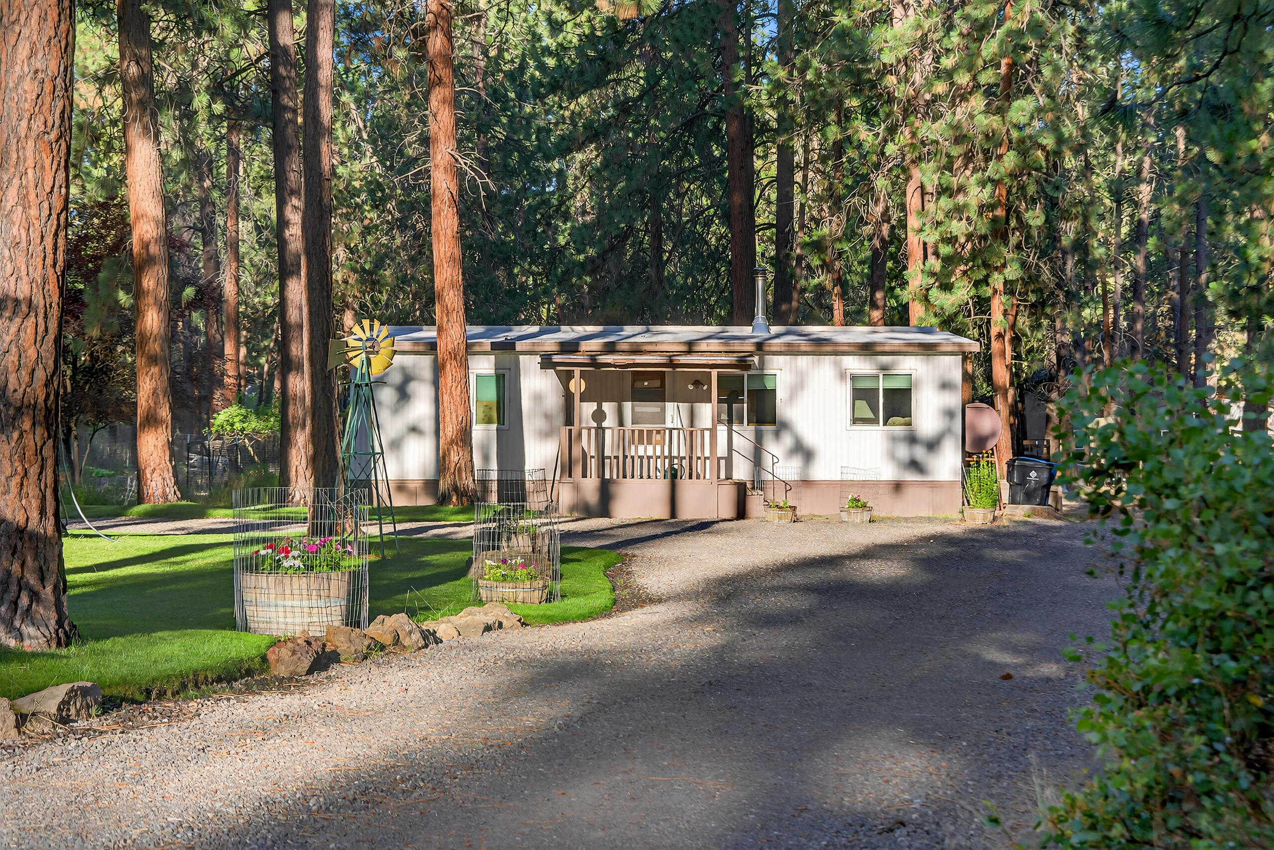 Meticulously maintained updated energy efficient home on just under an acre.  Home has been completely renovated with this owner including a metal roof; sheet rocked, textured and painted iinterior; birch cabinets in kitchen and bathroom; triple pane energy efficient Jeld Wen windows; 1 inch of insulation under the house; updated carpet and tile flooring; efficient oil stove and certified wood stove; new septic and drain field;  new refrigerator and washer.  Fenced areas for animals with a stable, feed/tack room and shop/shed.  A gardeners delight with 5 varieties of producing apple trees, and garden boxes filled with blue berry bushes, raspberries, onions, kale, lettuce, sage, rosemary, mint, and thyme.  Perennials and a lush green lawn make this property a stand-out beauty!  Completely fenced with areas for animals as well.  Come and see for yourself!!