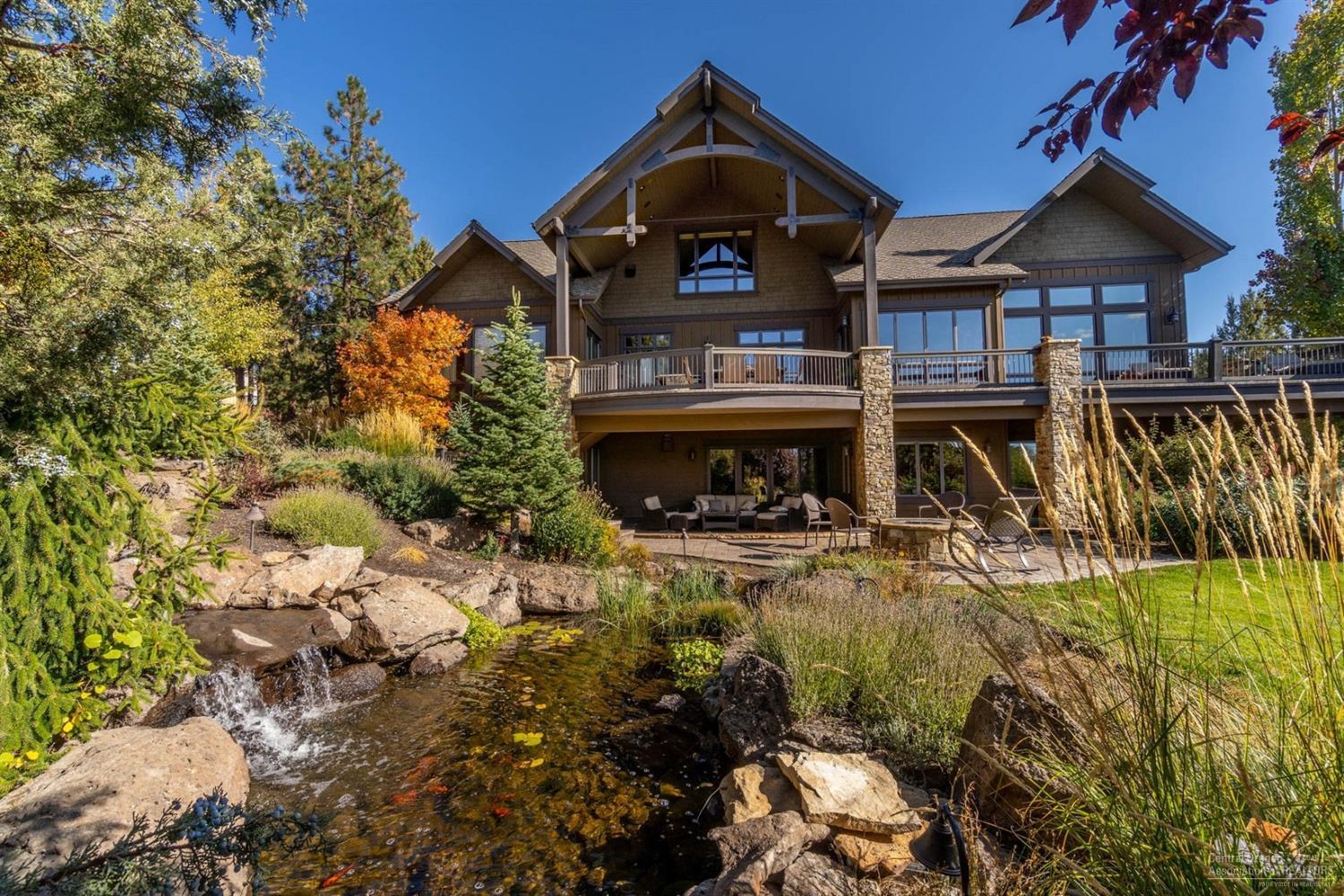 This custom home on Awbrey Butte invites family gatherings, w/ 2 expansive levels of entertainment space. On the main level, a great rm boasts a gas FP & Cascade views. The gourmet kitchen includes multiple ovens, high-end appliances, and access to the back patio. A master on main offers views, generous walk-in closet, & a two-sided FP that warms both the bed & bath. Downstairs, find another living area, FP, bar, indoor pool, sauna, and a pool table. Patio features a hot tub, fire pit and an outdoor kitchen. Three bedrooms, three bathrooms, and addt'l laundry rm round out the lower level. This home also features an office, a fifth bedroom suite, & a 4-car garage. Above the garage, an unfinished space could be a separate apartment. Use the Control4 system or cell phone to control many of the home's electronics, including lights and TVs. With custom features like tongue-in-groove soffiting, natural stone walls, & post-and-beam construction, this home takes luxury living to a new level.