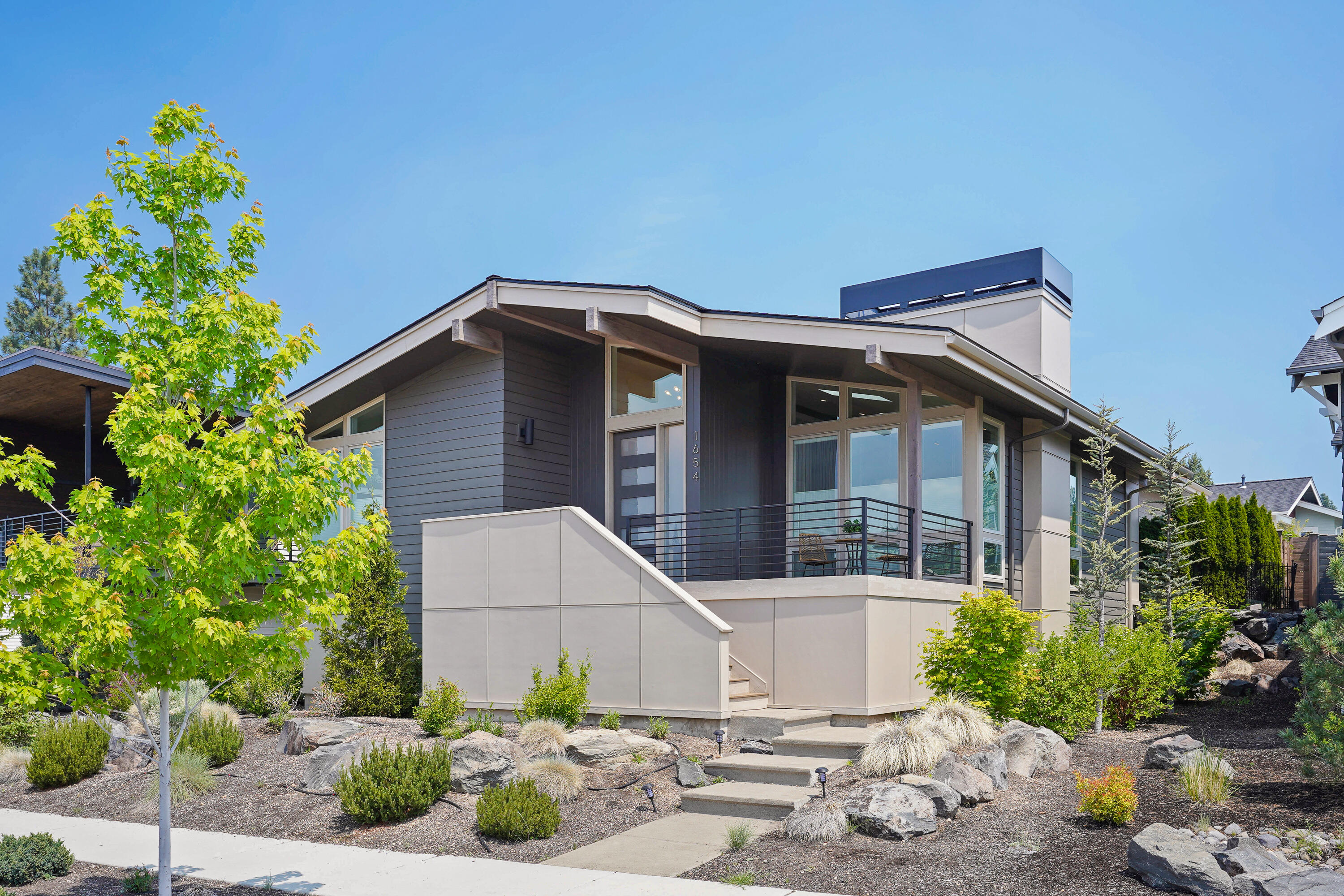 You will love this single-level Contemporary home built by Heritage Homes and located in the heart of NWX; minutes from great schools, shops, restaurants, and parks. The home offers vaulted ceilings, wide-plank wood flooring and luxury finishes throughout. The huge island kitchen has quartz counters, white cabinetry, & Jenn-Air appliances; Great room has sky lights and gas fireplace. Primary BR is separated from the others and features a stunning bathroom with tiled walk-in shower. Other features include a large laundry rm, 2-car garage plus xtra parking pad, and a fenced patio with alley access.