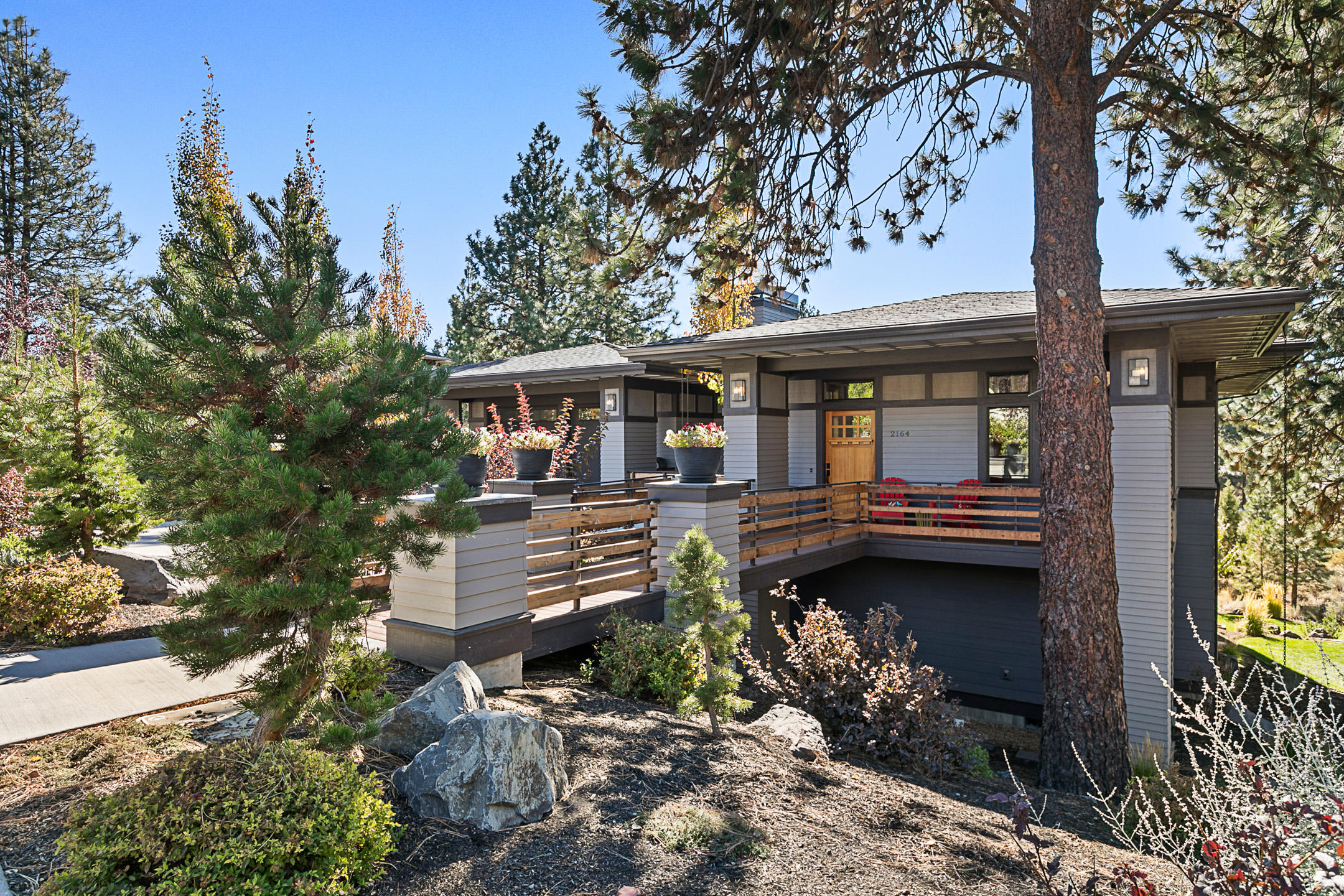 You will love this contemporary beauty in Bend's premier westside neighborhood of Northwest Crossing. The unobstructed southern exposure is captured
through large wood wrapped windows and sky lights. 10 foot ceilings and hardwood floors provide a feeling of space and tranquility. LED lighting, central vac
system, and Platinum Earth Advantage Certified for energy efficiency. Chefs kitchen with 6 burner gas range with hood, built in pantry, and separate island with
sink. Office (with a closet), laundry room, and master suite upstairs. 3 bedrooms (1 en suite) with another full bathroom downstairs. Also downstairs is a large
family room and mini kitchen. Multiple decks for eating and gathering. Immaculate 3 car (tandem) garage with epoxy floors and shop area. Large .43 acre lot
that backs up to Parks and Rec trail system with easy access to Phils Trail, Downtown, and schools. Large extra storage space and workout/bike room not
included in the square footage. This home can't be missed!