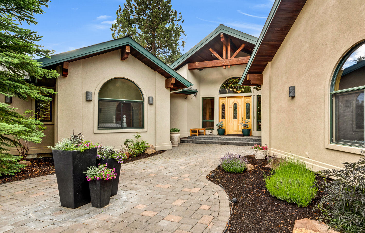 Seclusion awaits in this gorgeous single-level home built by Steve Berg, Sound Construction. First time listed, the home is a masterpiece of style & elegance with living spaces of unparalleled beauty. Great room features vaulted tongue-and-groove wood ceilings, gas fireplace, built-in cabinets, wet bar, hardwood floors & metal-clad wood windows. Abundant cabinets in the kitchen, large island, premium SS appliances & walk-in pantry accommodate the most particular chef. Owner's suite includes sitting area & gas FP, oasis bathroom with two vanities, heated floors, steam shower & two walk-in closets. In addition to two guest rooms, home offers spa solarium accessible from owner's suite or hall, office with two built-in desks & ample storage, large art studio & laundry room. Two-bay, four-car garage features heated floors, overhead electric heater in workshop bay, tremendous built-in cabinets & separate storage room. Trees & shrubs transition to native vegetation on this 2.38-acre lot.