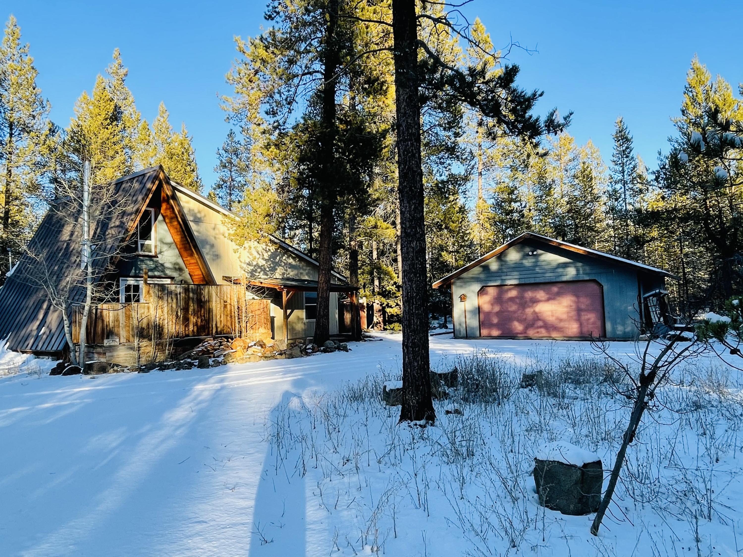 Cozy A-frame home built in 1976 with large addition in 2007 that has not been fully completed inside. Needs some TLC but this cutie has so much potential. Make this your perfect vacation getaway or full time home. 1.11 acre treed lot offers lots of privacy. Close to the lakes and mountains. Conveniently located close to town and Hwy 97, but not too close. There is a 24'x24' detached garage and other outbuildings. Has small detached bunkhouse which needs some TLC to be useable. Garden area in fenced in yard. Call your Realtor today to setup a showing.