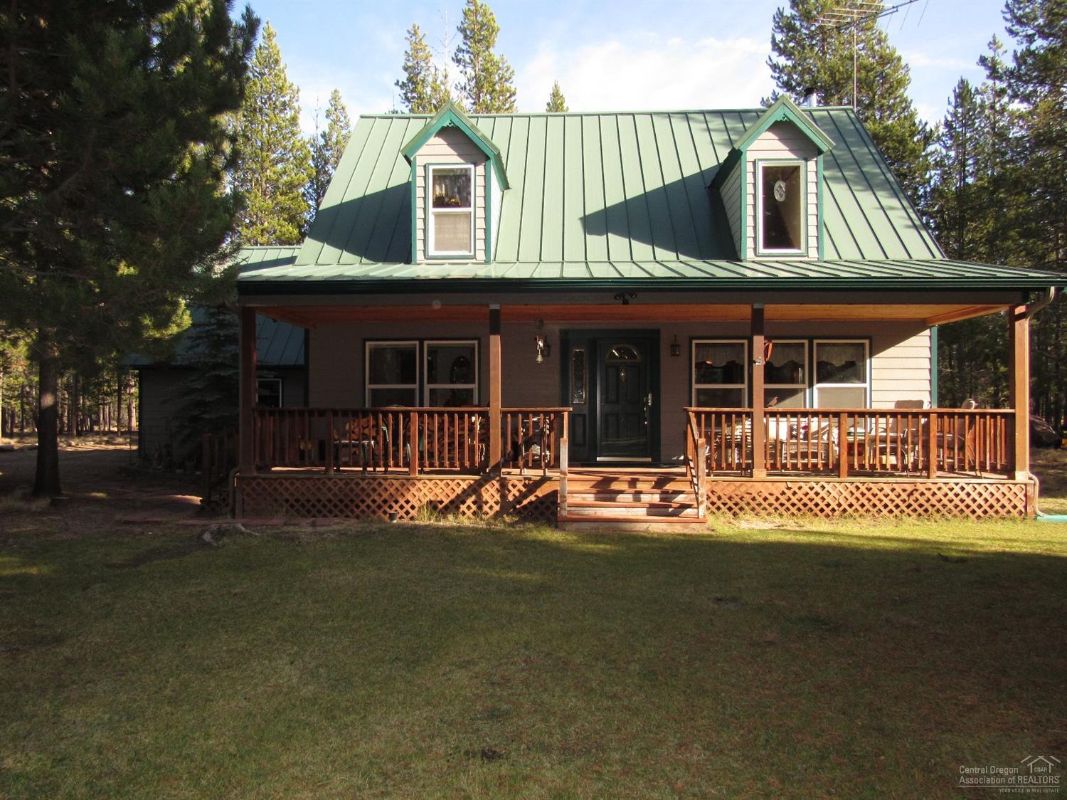 Complete with it's own herd of deer that visits daily! Immaculate custom home is on 5 acres & borders BLM land for added privacy. Beautifully landscaped w/several flower gardens. A must see home w/ lots of light. Skylights, custom carvings in wood railings, maple plank wood floors, granite counters, hickory cabinets, loft, pine walls, 3 different views from LR windows/sliders, covered porch, large back deck, bench seats w/ storage in master bed. Heated work area/storage space above garage has down ladder.