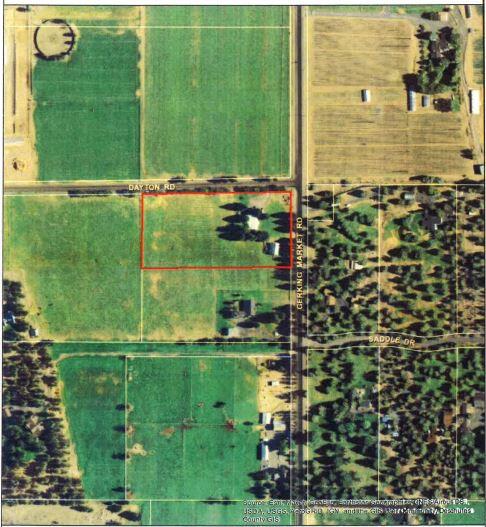Located in the desirable Tumalo area this small irrigated acreage is a rare find. The level corner lot currently has a 1972 manufactured home with a stick built addition, double car garage & a sturdy 48x36 shop/storage building. Quiet & peaceful with mature trees, 4.3 acres of irrigation & a wheel line. This would make a great hobby farm or the perfect spot to build your dream home. Adjoining 9.64 acres, MLS#220117139 , also available for sale. Buy them both and create a nice mini estate. Great Cascade Mtn Views. In an area of higher end homes.