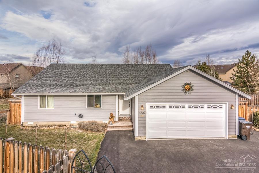 Welcome home! If you've been looking for a single level home on a huge lot in Redmond this is the one! This three bedroom, two bathroom home sits on a .30 acre lot with a fully fenced back yard. You'll love the natural light from the floor to ceiling windows in the great room. The kitchen features an oversized pantry and a large prep space looking into the great room allowing you to be part of everything going on. The nicely sized master has space for all your bedroom furniture plus a large walk-in closet and full bathroom. Step out the back door to a large paver patio and pergola plus a huge lawn, storage shed and paved walkways. The large, paved, private drive offer tons of parking for all your toys.
