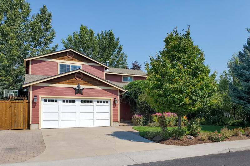 Welcome Home! To this Immaculate one-of-a-kind home located on a beautifully landscaped Corner lot in NE Bend. This beautifully updated home is move-in ready. The home has a beautiful back yard that has something for everyone including Hot Tub. The kitchen has Stainless Steel appliances and quartz counter tops with a breakfast bar. The main living area is carpeted and a gas fireplace. On the main level you will also find the master bedroom and bath which boast a soaking tub. Upstairs you will be greeted by the open loft area with a gas fireplace and 3 bedrooms with a full bath. The backyard is made for entertaining and gorgeously landscape with sprinkler system in both the back yard and front yard. The AC was new in 2016, a 50-year roof in 2017, Exterior paint in 2018, New hot water heater in 2019, New carpet in 2020. This home is a must see. Schedule your showing now.