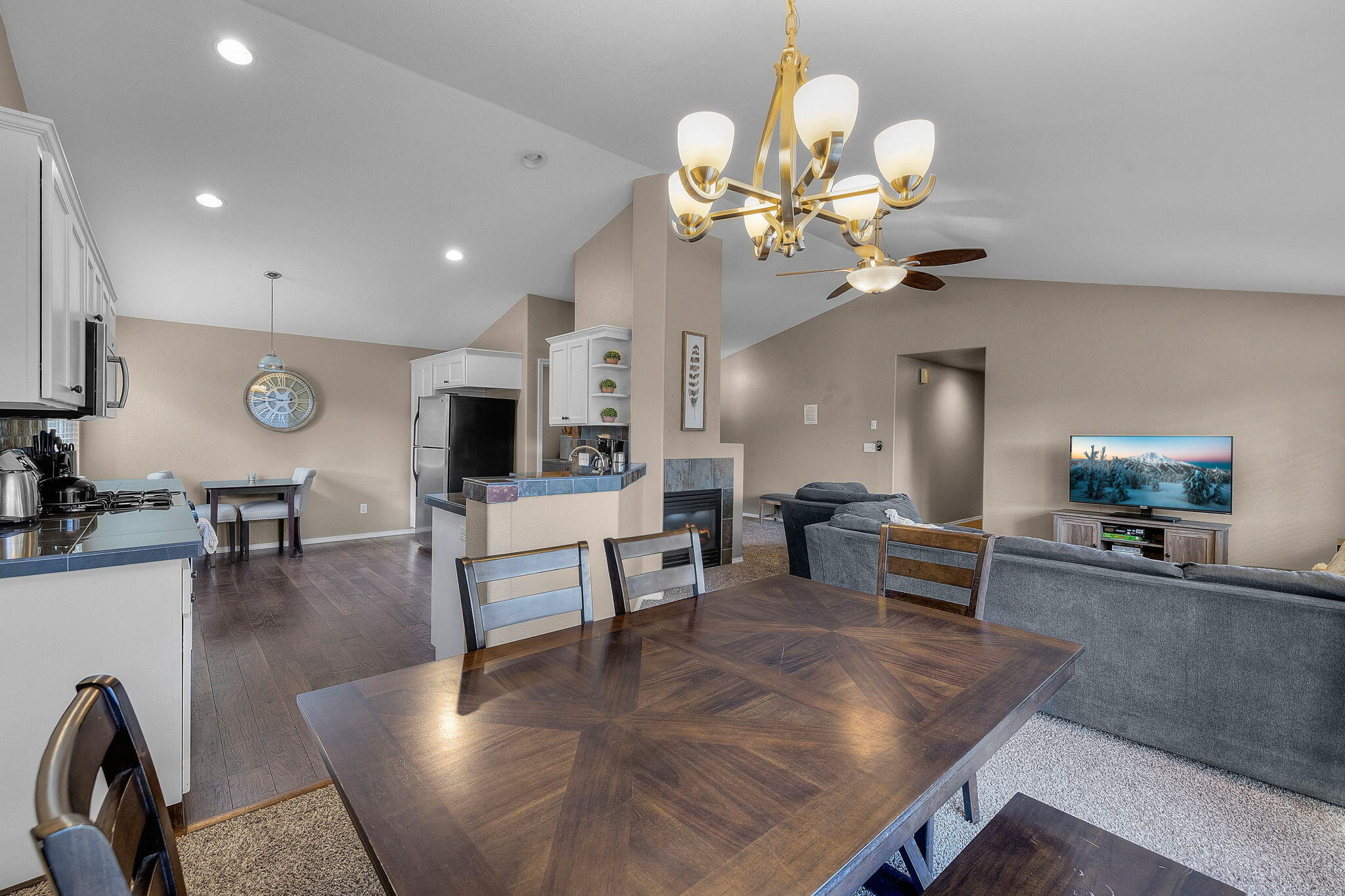 This 3-bedroom, 2-bathroom home is nestled in a quiet neighborhood just off Brookswood Blvd, only minutes from the Old Mill District. The open layout features vaulted ceilings, a cozy gas fireplace, and a well-appointed kitchen with stainless steel appliances. The spacious primary suite includes a walk-in closet and an en suite bath with a soaking tub, double vanity, and tiled shower. Outside, enjoy a large, fully fenced backyard—perfect for entertaining or relaxing in privacy—as well as convenient RV parking.