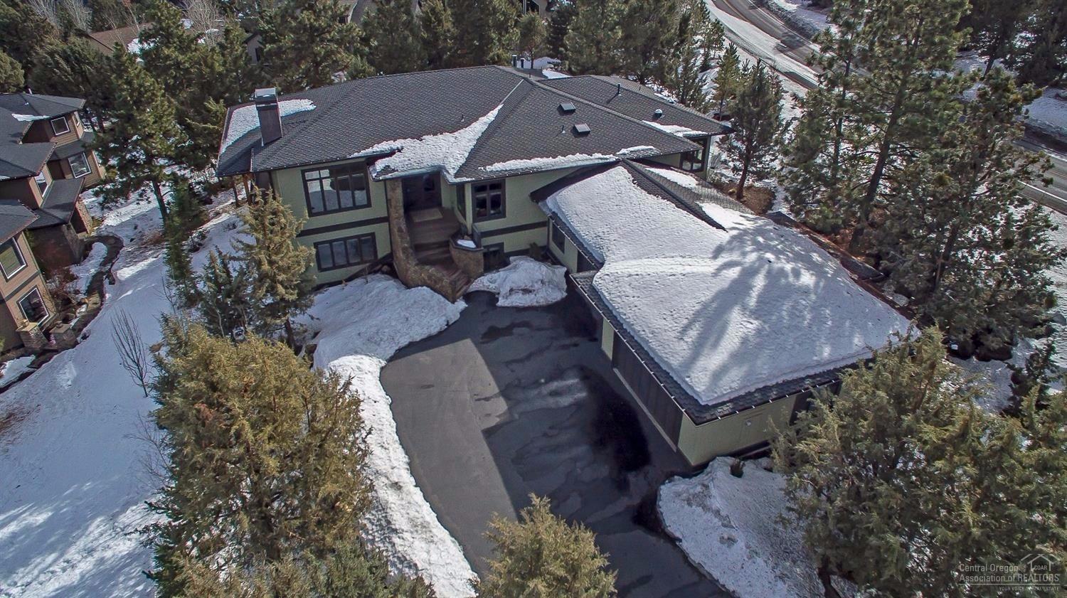Gorgeous custom built home with high end finishes and spectacular views in a quiet and convenient location. This home features large vaulted ceilings, 3 gas fireplaces, heated bathroom tile floors, and Brazilian cherry hardwood floors. The gourmet kitchen includes concrete counter tops, double ovens with a warming drawer, two dishwashers, gas cook top, American cherry wood cabinets, and a large walk in pantry. Retreat to your private oasis with two grand masters with soaking tubs & walk in tile showers.