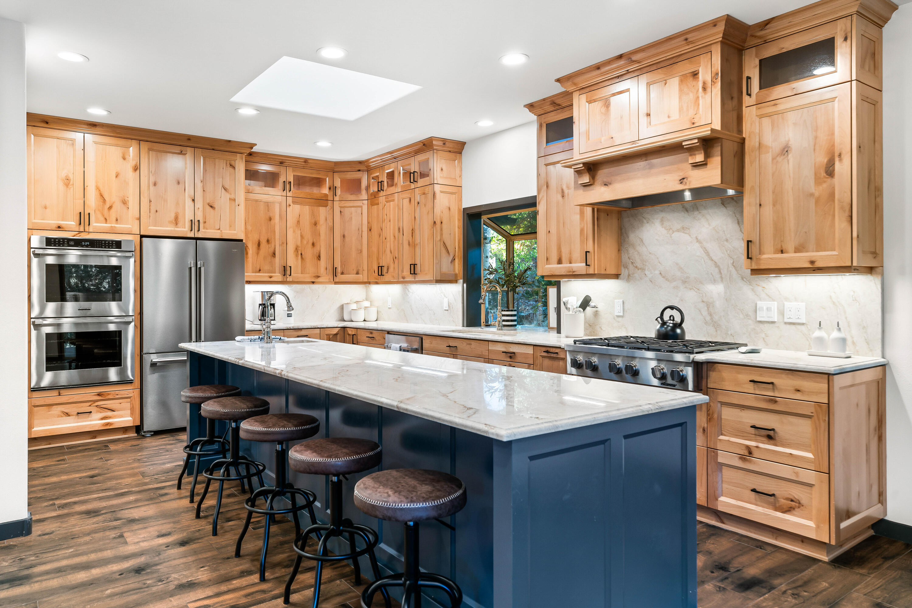 This high-end, fully remodeled in 2022 Sunriver home offers 2,500 sq. ft. of main level living on a quiet street, perfectly positioned at the edge of Sunriver Resort, overlooking the 6th hole of Woodlands Golf Course. Enjoy GC views from both levels of the home. Luxury finishes include stunning quartzite counters & elegant tile flooring throughout. The chef's kitchen features a Dacor range, two dishwashers, 2 Ovens and an oversized island for effortless entertaining. With 5 bedrooms & 4 full baths, there's plenty of space for everyone. Zoned heating w/ radiant floors downstairs ensures year-round comfort. Multiple living areas, 3 gas fireplaces, & a large second-floor deck w/ a hot tub & outdoor kitchen make this home an entertainer's dream. The 3-car heated garage, w/ epoxy flooring, is set up as a game area, & a Tesla charger is ready for use. This home is move-in ready, w/ nearby hiking, fly-fishing, biking, & skiing. Ready for the next owners to enjoy