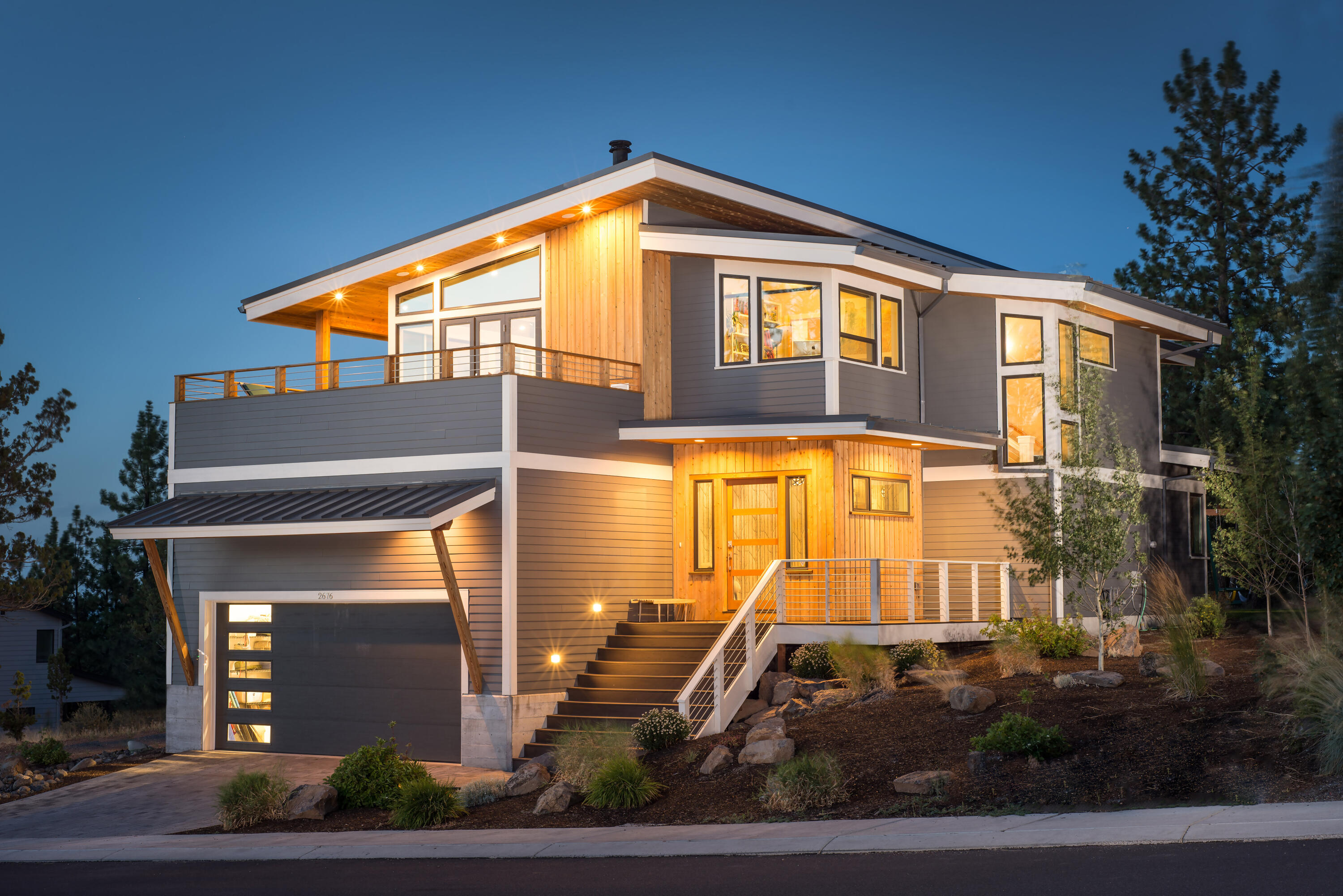 True curb appeal awaits you at this Modern Dream of a home in the highly coveted Marken Heights neighborhood on Bends Westside! This open floor plan offers clean lines, bright lighting, and a timeless touch throughout with Bamboo floors, accent walls, high end finishes, and true style. This home was intentionally designed as a reverse living floor plan so the beautiful mountain views could be well enjoyed. A bonus room, 3 bedrooms/2 bathrooms on the main floor, lead you to a fenced backyard with a private feel, and hot tub. Head up stairs to the light filled & very happy living, kitchen & dining that is surrounded by a wrap around deck to enjoy mountain views and sunsets. On this floor you will also find a refreshing office space with the perfect view of bachelor, The master suite, & fitness room. Lastly, a spacious 3 car tandem garage with extra storage. This perfectly appointed LEED certified home has been exceptionally maintained and is just minutes from everything Bend has to offer