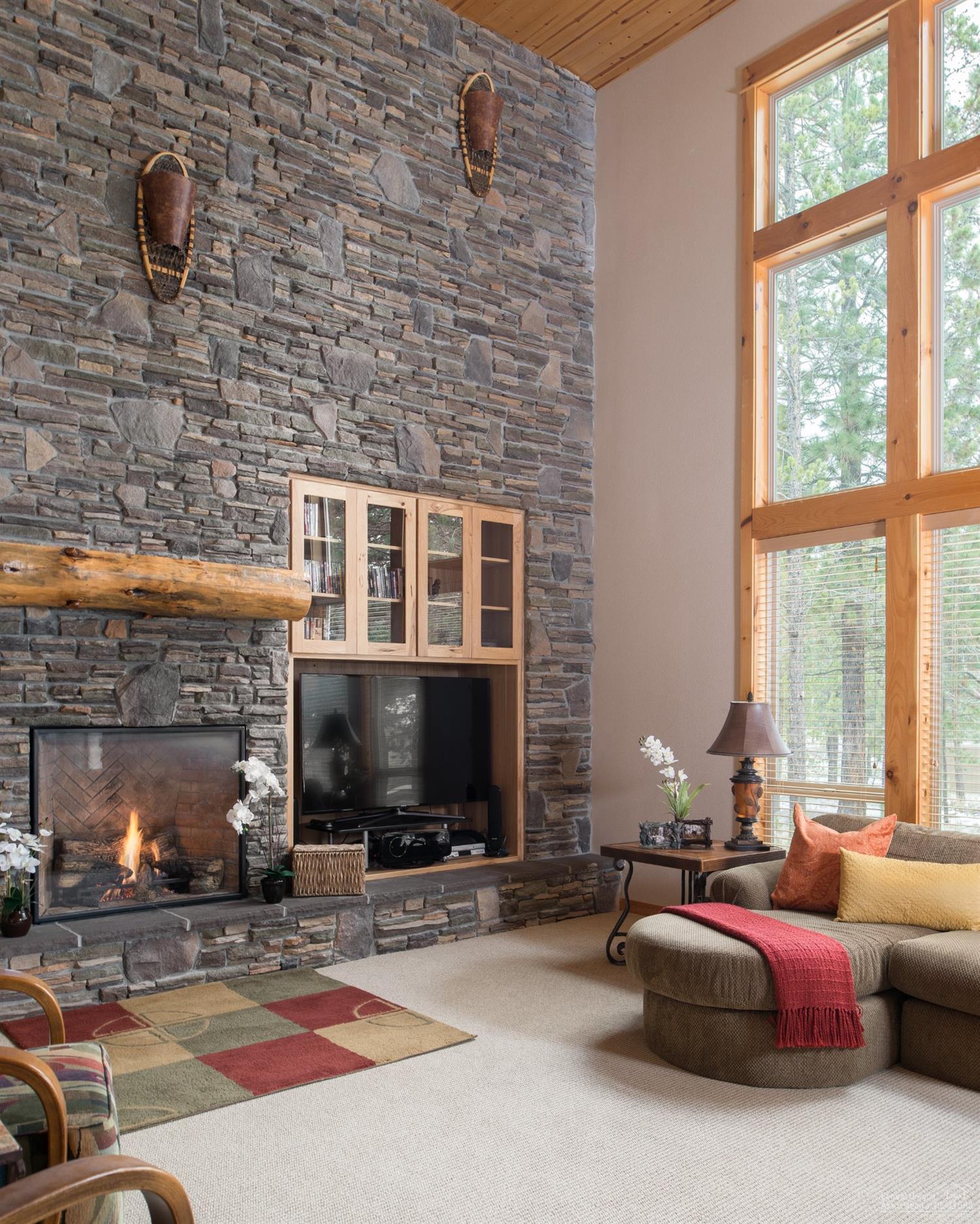 Time To Live Large- and this is it! Offering 7 Suites plus a bonus room w/ pool table. There are 3 bedroom suites downstairs & 4 up. Great room features vaulted ceilings w/ open beams, a gas fireplace w/ pine mantle & rock surround creating a beautiful focal point. Gourmet kitchen offers high end KitchenAid & Bosch stainless steel appliances; 5 burner gas stove top, double ovens & granite counter tops. Quiet North end, close to the River. Hot tub, 2 A/C units, 2-74 gal water heaters, triple car. SHARC Paid!
