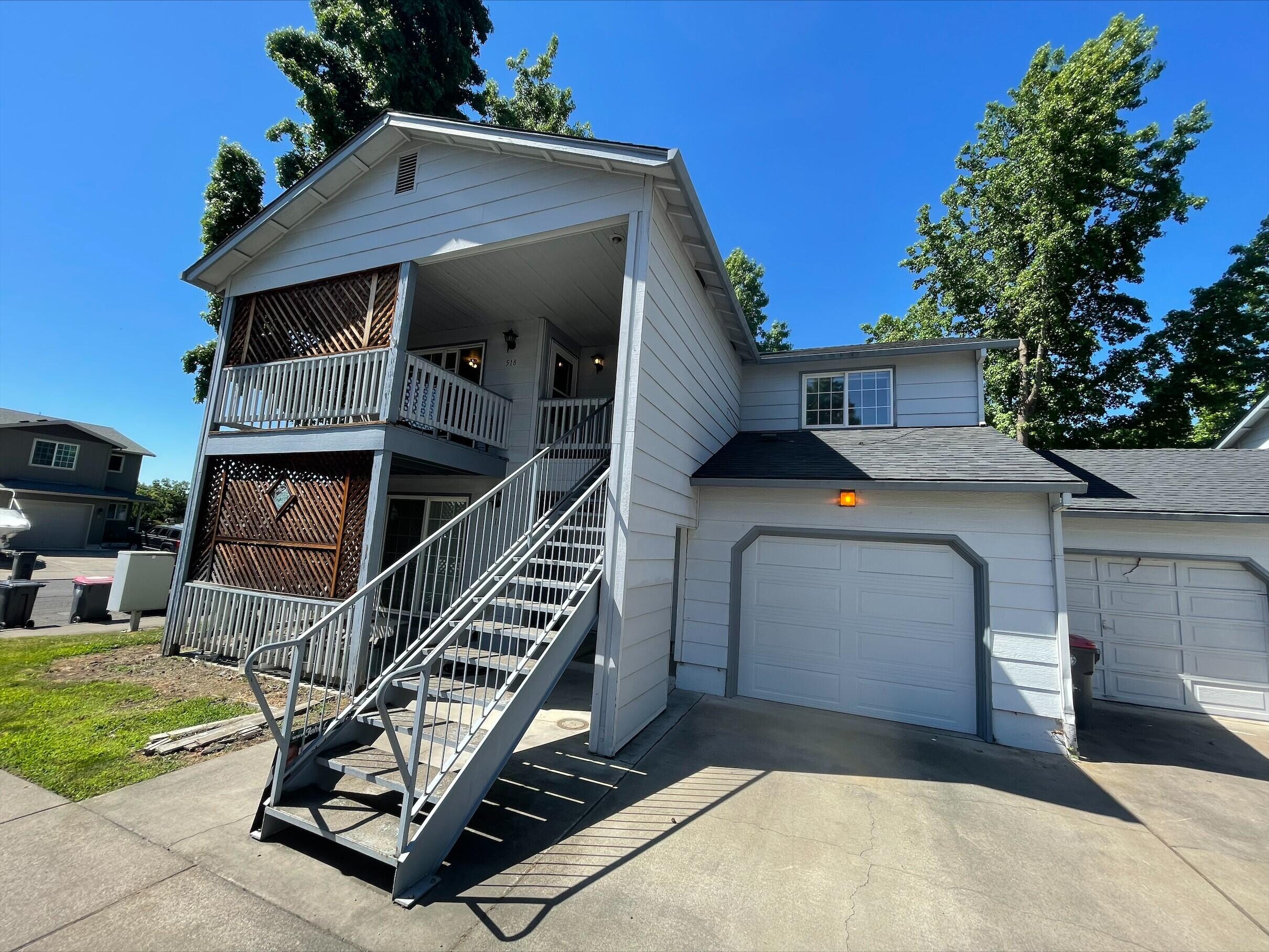 Perfect for the first-time home buyer or investor! This beautiful home is located in desirable Castle Court Condo Community in Central Point. Very spacious with 3 bedrooms and 2 full bathrooms with inside laundry, and an additional detached, oversized single car garage. House is vacant and ready for immediate occupancy. Laminate floors throughout, custom paint colors, extra-large balcony, with privacy lattice and privacy, as well as large vinyl windows which let in natural light. This is a great opportunity for a first-time homeowner or investor in an incredible location. Condo fees are just $240/ month and include exterior maintenance and garbage service. Tour today!