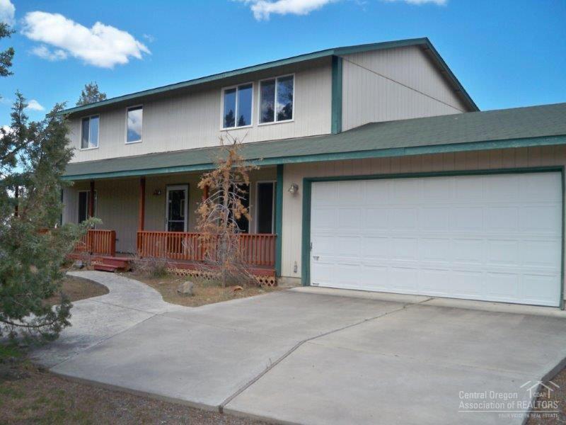 Quiet country home on a large 3.3 acre lot close to town. 3-bedrooms, 2.5 baths with 2080 sq. ft. of living area. Laminate wood flooring in living room and dining areas. Covered front porch, fenced. Bonus room for office. Large detached 36x48 garage shop, greenhouse and much more. Room for RV's. Paved streets.
