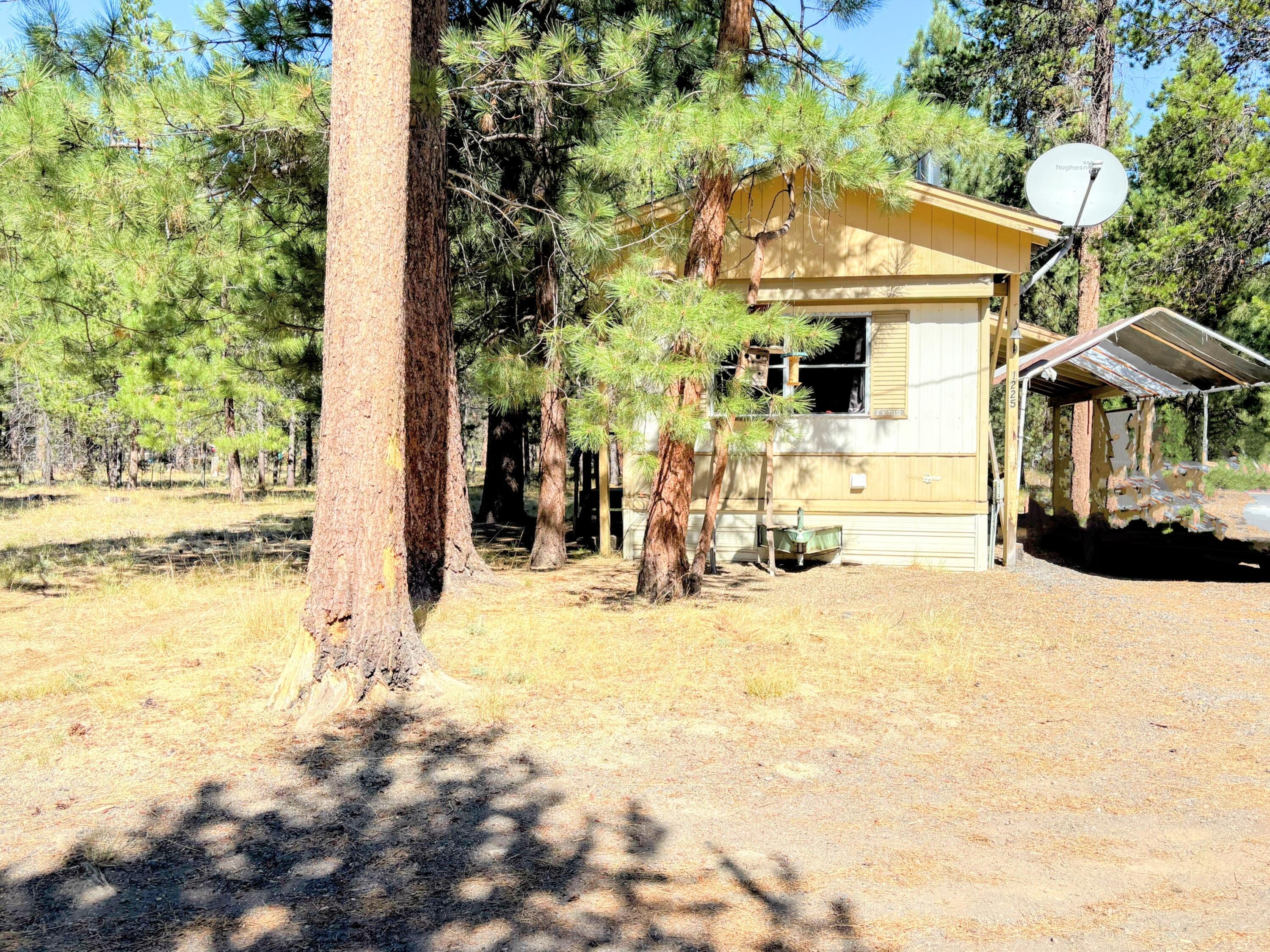 Check out this charming property featuring two separate tax lots and a manufactured rental on one, all situated on a fully fenced, flat 2.05-acre lot just 10 miles south of town. The existing 520 sq ft home, built in 1974, is in good shape and comes with a new wood stove to keep you warm during the cooler months. With two lots to work with, you have plenty of optionsâ€''whether you want to build a second home, create a private estate, or develop a multi-family residence. This property offers a fantastic opportunity to craft your dream home, a cozy getaway, or a multi-unit living space.



Taxes and acreage listed are combined totals for both properties.