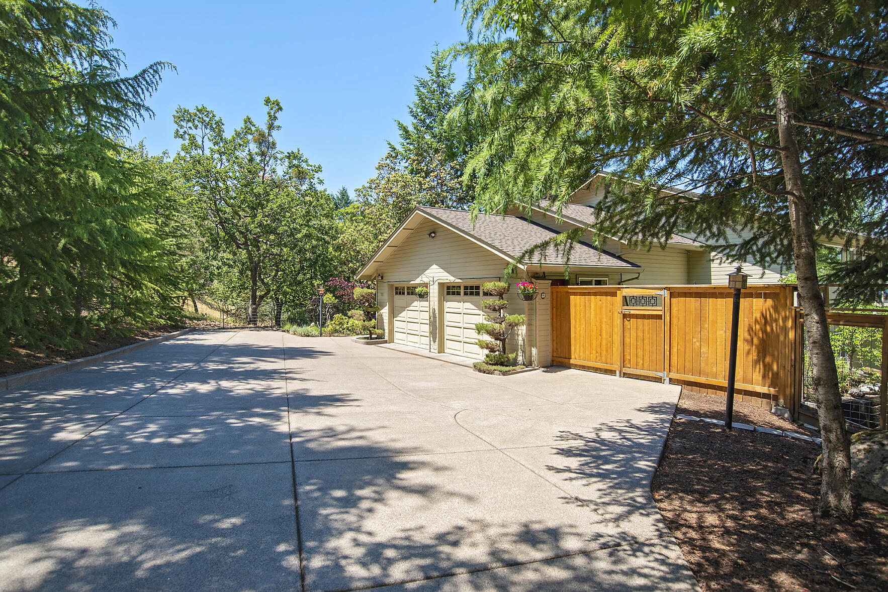 Fantastic setting with panoramic views. This well cared for 3 bedroom 2.5 bath + office with built-ins has an incredible layout with an open floor plan, natural light and chef's style kitchen with six burner range, granite counter, custom cabinetry and Birch flooring. Great room/living room adjacent to the expansive deck. Formal dining features Alder wood built in cabinet buffet and leads to a sweet balcony that would be the perfect spot to sit with your morning beverage. Oversized master bedroom is located downstairs and offers a fireplace, private deck and en-suite master bath with large jetted tub. This wooded setting feels magical with the abundant Madrone trees, and extra large terraced garden for growing your own fruits & vegetables. Cherry and plum trees, flowering shrubbery, greenhouse, deer fence, horseshoe pit + so much more. Not far from the Pacific Crest Trail if you feel like hiking, yet still close to town, this is an outstanding property.