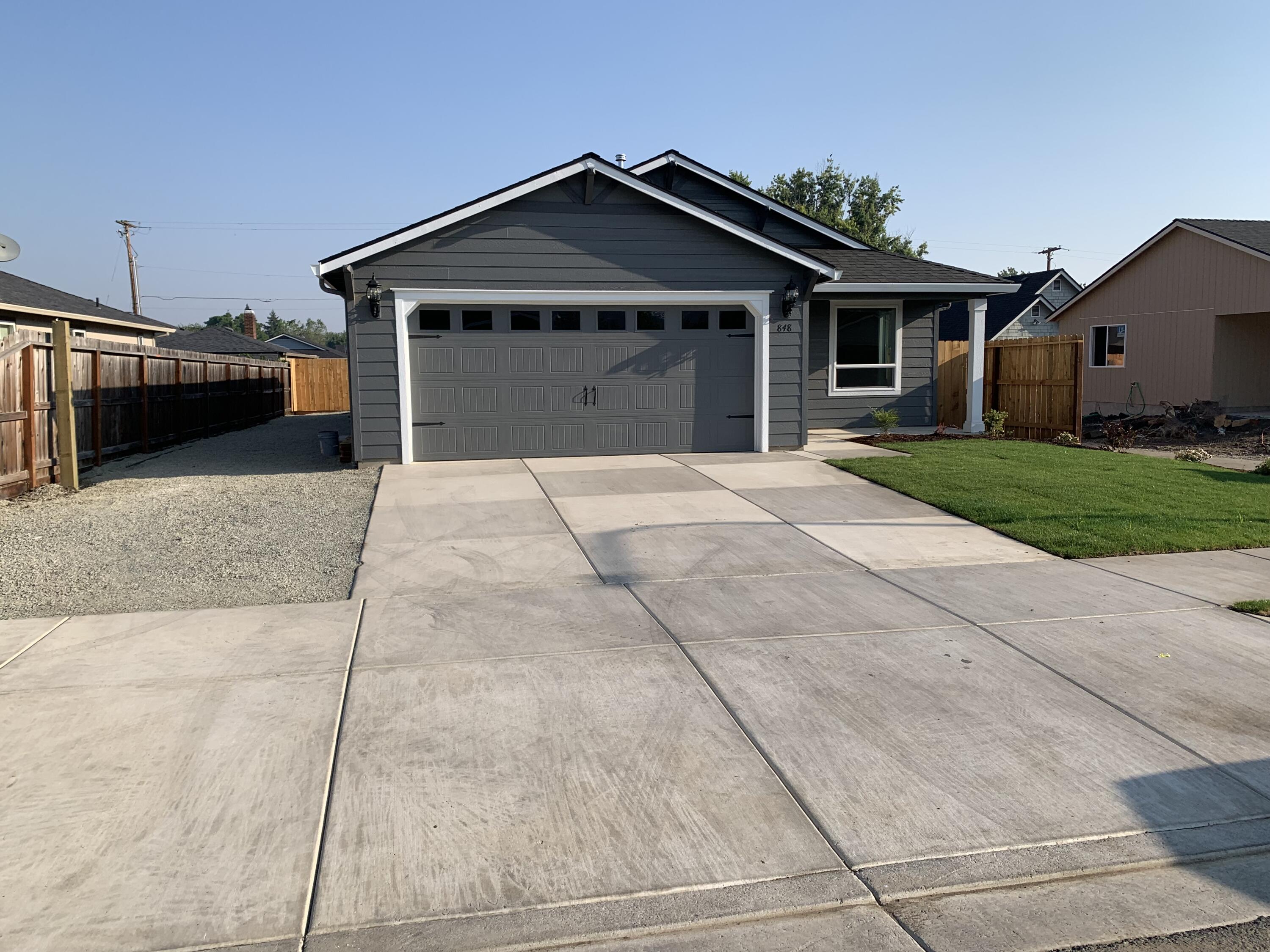 SUDDEN VALLEY SUBDIVISION! Centrally located for easy access to surrounding towns.  Gorgeous 1405' sq.ft, single level living. 3 bedroom, 2 bath home built by Horton Homes Inc..  Beautiful area in south west Medford.  Open floor plan with vaulted ceilings makes this home feel spacious. Home features, open concept floor plan, Custom cabinets, Granite, Gas appliances, Laminate flooring. Covered back porch.  Approx.12' RV Parking and much more. Selling agent is related to Seller and Builder. Some pictures are for illustration purposes only but very similar to actual.