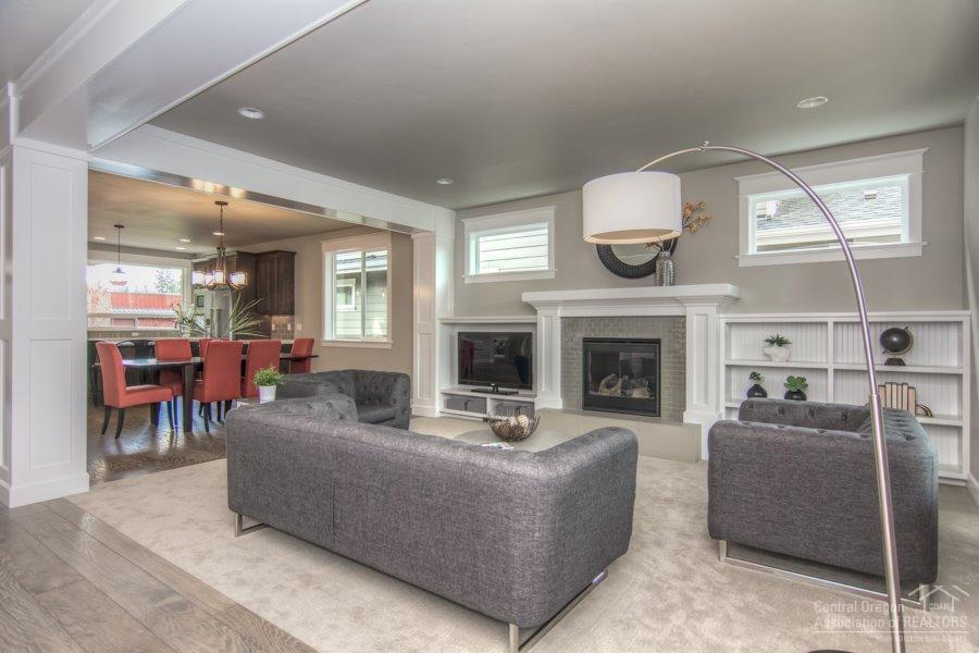 New Stonebridge home in River Rim. Main level master suite with walk in closet and tile shower. Main level also includes den, gas fireplace, hardwood flooring, 9' ceilings, chef's kitchen with large pantry, island with slab quartz countertop, full height backsplash, stainless appliances, and under cabinet lighting. Second level includes 2 bedrooms and bonus room/4th bedroom. Earth Advantage home with tankless water heater. Three car garage is wired to plug in an electric car. 2-10 home warranty included.
