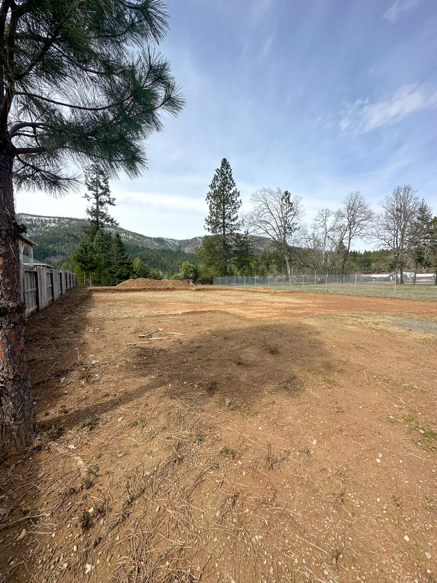 Ready to build .30 acre lot with fantastic views of the mountains located in this quiet newer subdivision. The lot has been professionally graded and the building permits have been paid for and approved per the seller! Bring your builder or let us connect you to one. Located between Grants Pass and the Oregon Coast. Just minutes from town, the Illinois River, and the Golf Course!