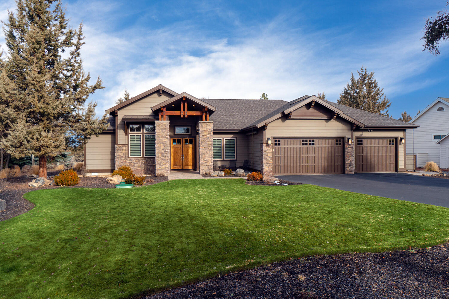 This stunning home was featured on the 2016 COBA tour of homes and is loaded with upgrades and luxury finishes throughout. Single-level award-winning floor plan with beautiful views of the fairway featuring a great room with custom stacked stone fireplace, vaulted ceiling, wall of windows, wood flooring, and hand troweled walls. Large open kitchen with expansive island, breakfast bar, slab granite counters, built-in buffet with china display, walk-in pantry, Wolf induction cooktop, and high-end stainless appliances. Spacious primary suite with dual-sink vanity, tiled walk-in shower, soaking tub, and roomy walk-in closet. Den with extensive custom built-ins and two workstations. Two additional bedrooms and a full bath for guests. Utility room with built-in cabinetry, sink, and large storage closet. Extended three-car garage with custom storage cabinets and workbench. Expansive paver patio in the back and front courtyard with remote awning. Certified Earth Advantage/Energy Star home.