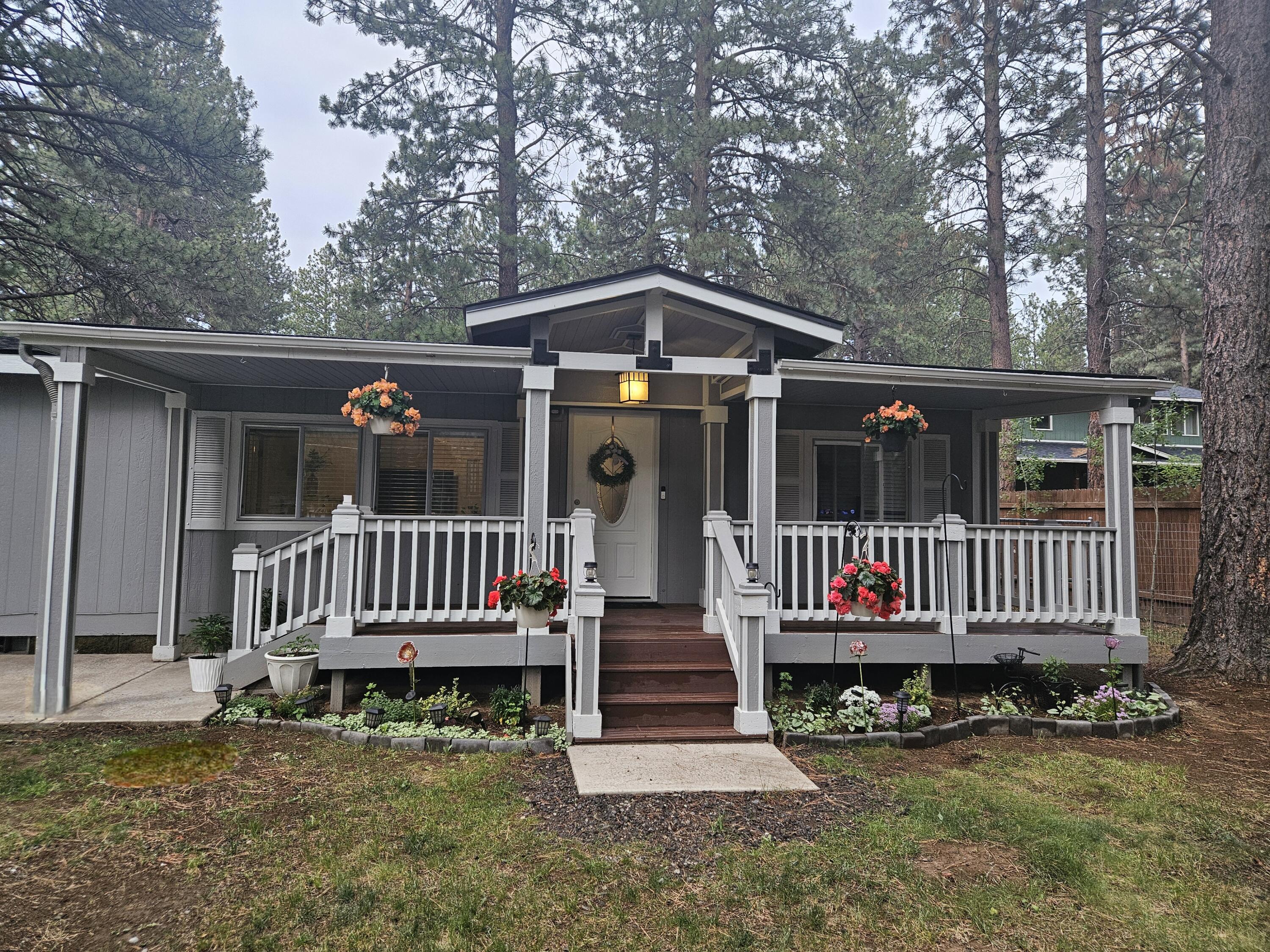 Make an appointment to see this cozy 3 bed 2 bath house with a large bonus room.  This craftsman style home is located on .89 of an acre. This cozy home has a large covered porch in the front where you can sit and enjoy the quiet neighborhood and the deck in the back is perfect for entertaining. There is an 840 sq ft detached shop permitted on March of 2023 on the property and an additional storage shed. This property offers privacy and plenty of room to store all of your outdoor needs. New roof installed March of 2025 New water heater was installed in June 2025. Water Heater: Rheem Performance Platinum 40 gal Smart High Efficiency Hybrid Heat Pump Water Heater. Agent is related to seller.