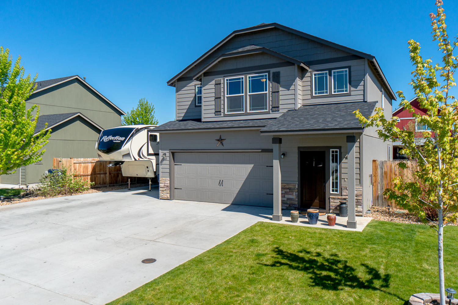 Love to entertain? This home is for you! Situated in desirable NW Redmond, this 3 br, 2 bath home offers an opportunity to live inside & out year round. Comfortable great room layout w/space for extended family opens up to a fantastic outdoor living space. Kitchen offers a gas range, SS appliances, breakfast bar & working island & pantry. Inside, all bedrooms & laundry are upstairs w/Master separation. Master br looks out to the back yard & features dbl vanities in the bath w/adjoining walk in closet. Two guest rooms are complimented w/a jack & jill style bath that's sure to please. Step outside & you'll discover an expansive stamped concrete patio, fire pit area & green space lawn to check all the boxes. Don't miss the hobby shed or extra storage! Have an RV?  It will easily fit comfortably on the west side of the house on a concrete slab w/easy access. Gas forced air w/ A/C.  Cascade views from guest rooms. Don't miss this one! No HOA fees, easy access to amenities. *4th br in garage