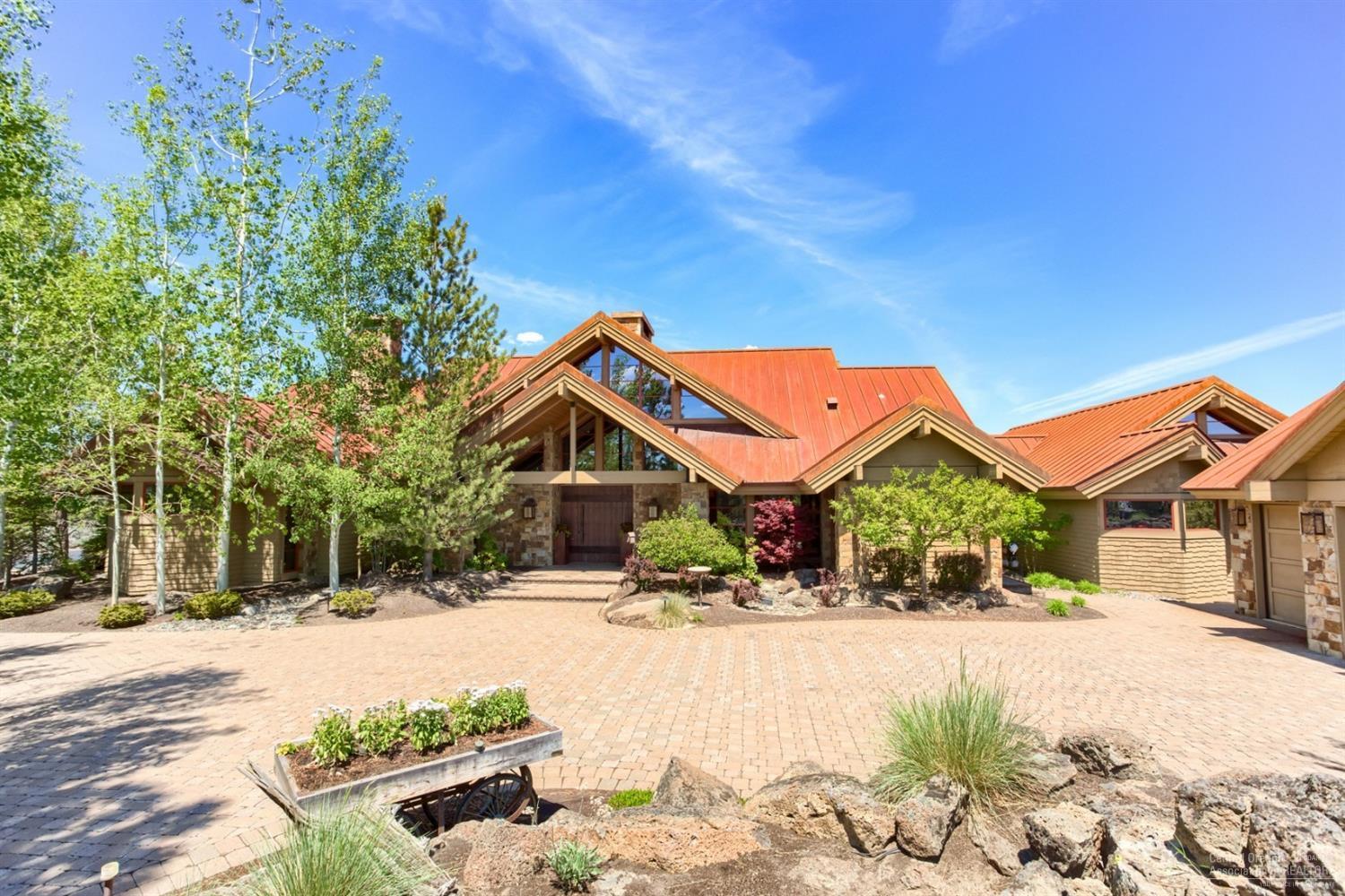 Pacific NW Lodge meets Contemporary in one of the finest offerings. This home is built to standards & challenges hard to describe/duplicate. Exposed timber frame construction supported by a central magnificent fireplace. An architectural marvel. Finishes are magnificent, interior furnishings are spectacular. All custom down to the cabinet hardware. Experience rustic elegance & northern views of the fairway & hole of Nicklaus No. 5; this is a one of a kind opportunity. Membership included & offered turnkey.