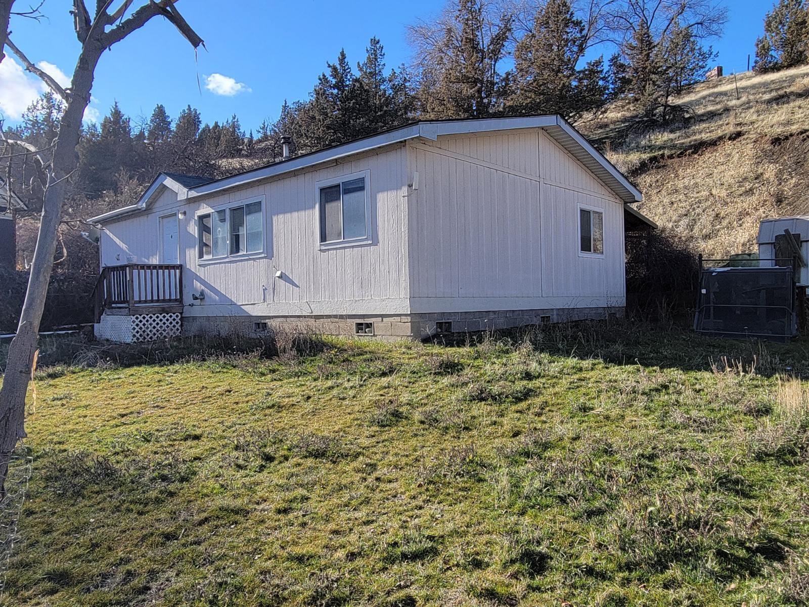 Take a look at this 3 bedroom, 2 bath home in Mitchell! This would make a great little get-a-way home or full time living in Wheeler County. The Mitchell city park, Tiger Town Brewing and the Wheeler County Trading Company are all located within 750 feet of the property. The school is also just a short distance away. Wheeler County has a variety of recreational activities to offer including rivers, hunting and public land to enjoy all that Central/Eastern Oregon has to offer. Comes with your own Grape Vines. Home sits on a slab with block perimeter and post/pier support and tie-downs which help qualify property for any type of financing programs. Whether you are in the market for full time living, a peaceful retreat or a rental in Wheeler County, this may check all the boxes. Possible incentives for quick close.
