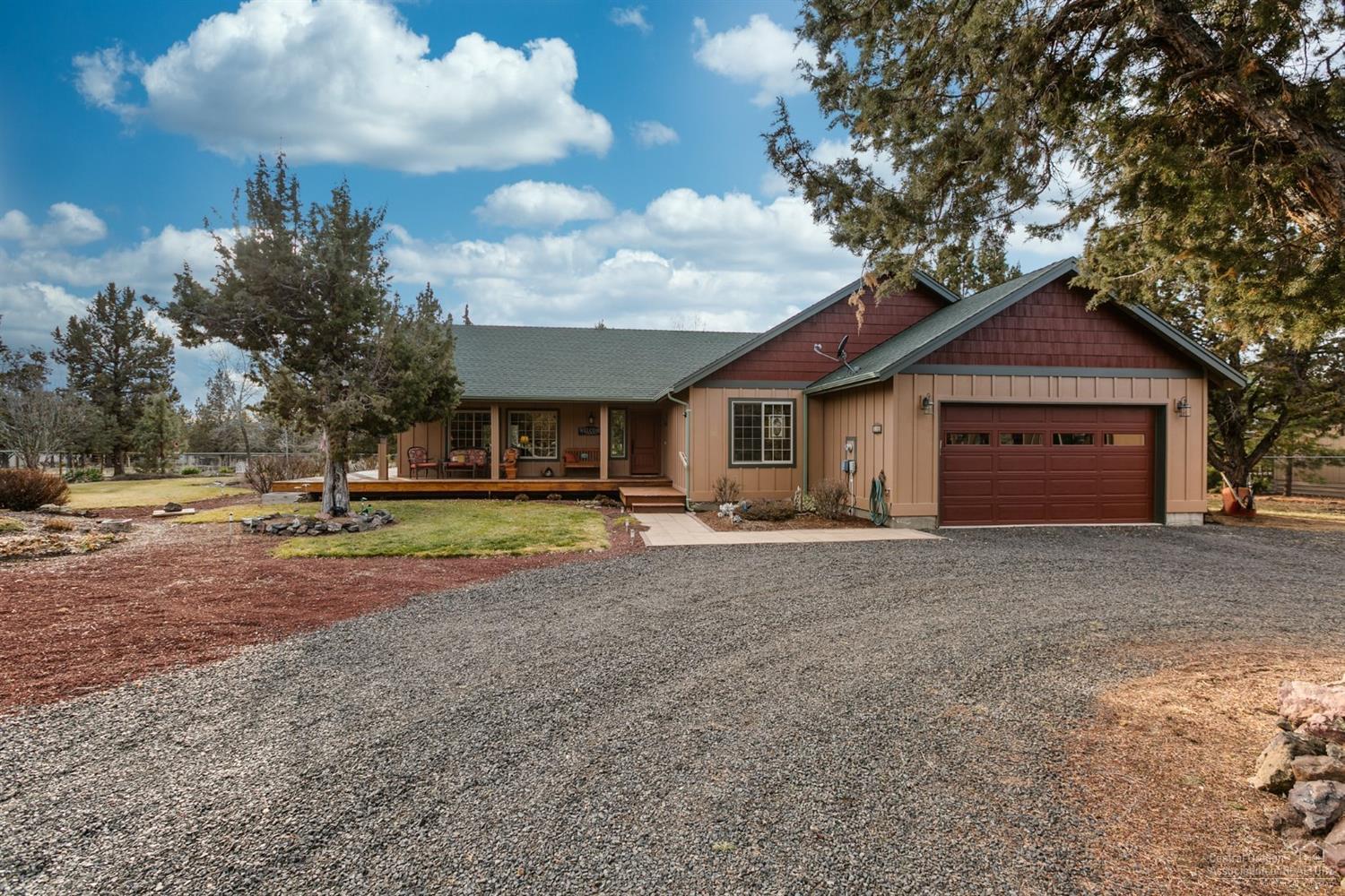 Enter this beautiful Custom-Craftsman home onto lovely hardwood flooring, with vaulted ceilings above and a propane fireplace as the focal point. Vinyl windows are wrapped in hardwood, with custom window coverings. Great room concept w/kitchen island/breakfast bar, cabinet pullouts, lazy-susans, stainless appliances, under and over cabinet lighting and a beautiful Tuscan recess for range/oven. Spacious bedrooms with plush carpets and large master en-suite with walk-in closet and built-in shelving. Loads of well-planned storage in this home! Dbl attached and finished garage with utility sink. Property is fenced and gated, with RV pad &amp; hookups. The icing on the cake is the detached 1320sf garage/shop with 2-car bays and two large finished and heated rooms for your man-cave, craft room or long-arm quilting machine. approximately 800sf of decking surrounds the home, with a garden area and a tree house for the young'uns! All this on a private 1-acre lot.