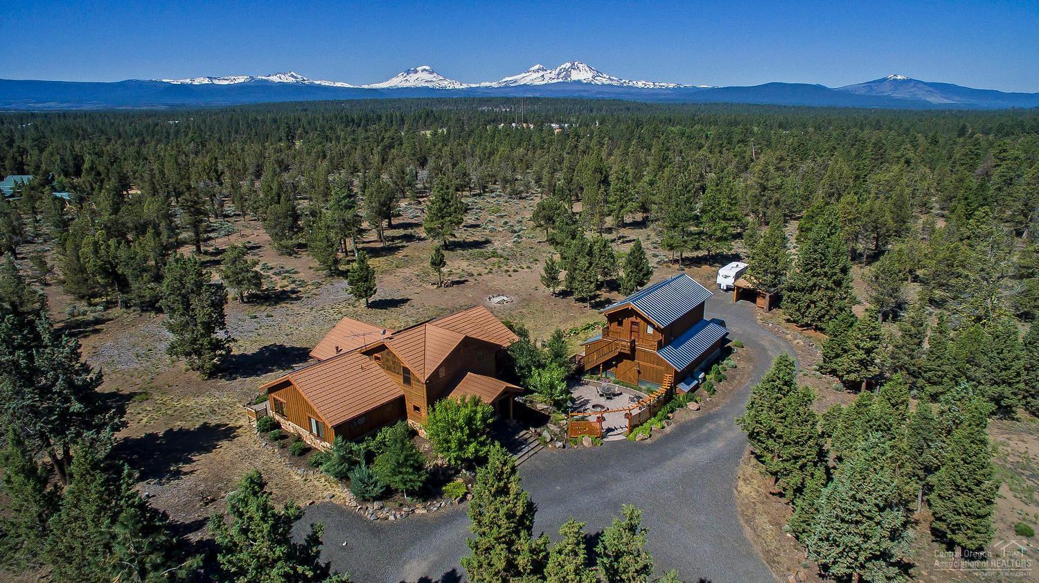 Timber Frame Home of the Year in 2009! Secluded 27 ac in Cloverdale with Mountain views. Open floor plan with vaulted ceilings, main flr master, walk-in shower, gourmet kitchen, office; upstairs master suite w/loft. Reclaimed fir cabinets & living rm floor, stainless appliances & island counter, granite counters, travertine tile. Highest rating energy efficiency w/SIP ceilings & walls, solar electric & hot H2O,in-floor heating. Detached ICF garage/workshop w/upstairs apartment. Stone-coated steel roof.