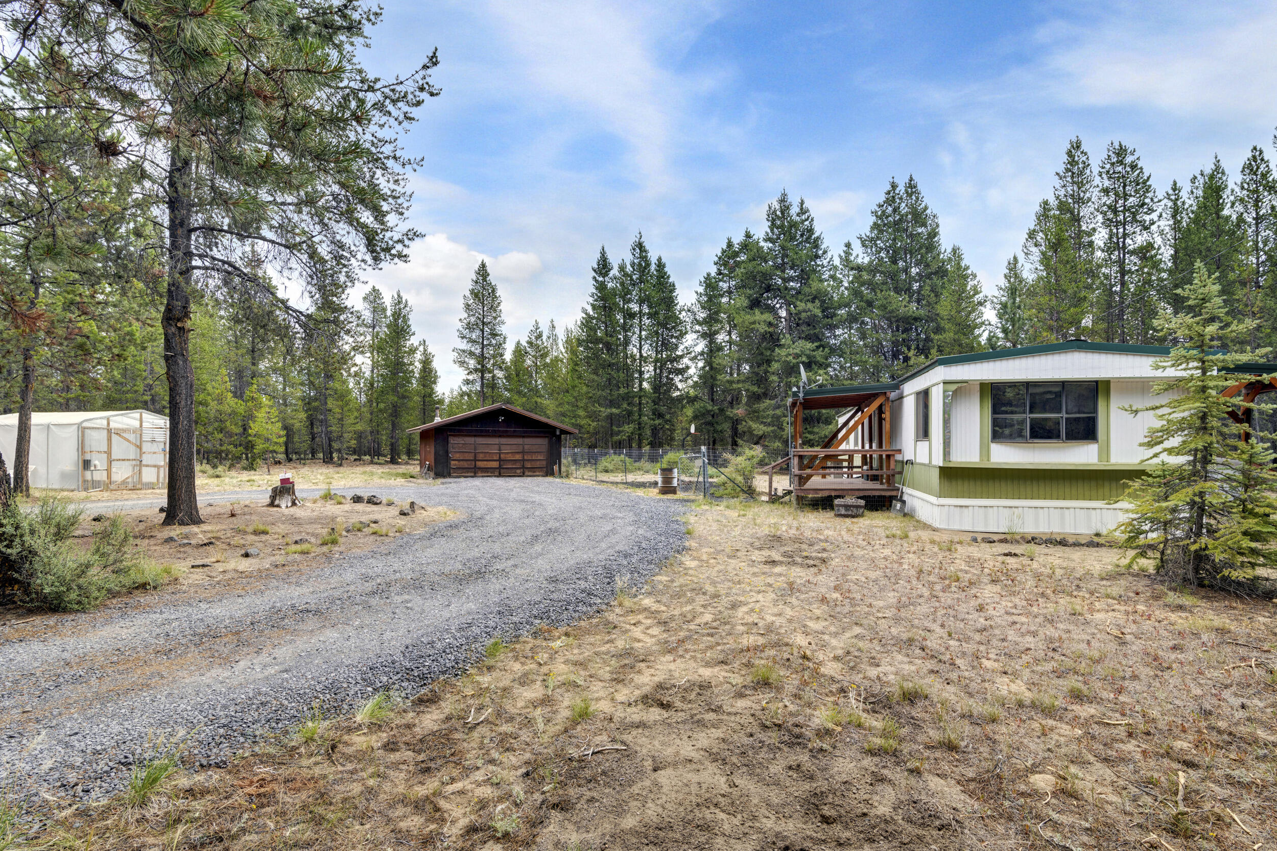 Welcome to your charming retreat nestled on 1.55 acres of picturesque land in the heart of central Oregon! This adorable 1980 manufactured home has 2 bedrooms, 1 bath
and has been updated while retaining its cozy appeal. Step inside to discover new flooring along with a new furnace and split unit ensuring optimal climate control
year-round. One of the features of this property is the new 50 ft well, providing a reliable source of water for your everyday needs. Imagine enjoying the tranquility of your
surroundings while knowing that you have everything you need right at your fingertips. Located centrally to all of central Oregon's activities, this home offers easy access
to a wide range of outdoor adventures, from hiking and biking to skiing and fishing. Whether you're seeking a weekend getaway or a permanent residence, this charming
abode offers the perfect blend of comfort, convenience, and natural beauty. Don't miss your chance to make this delightful retreat your own!