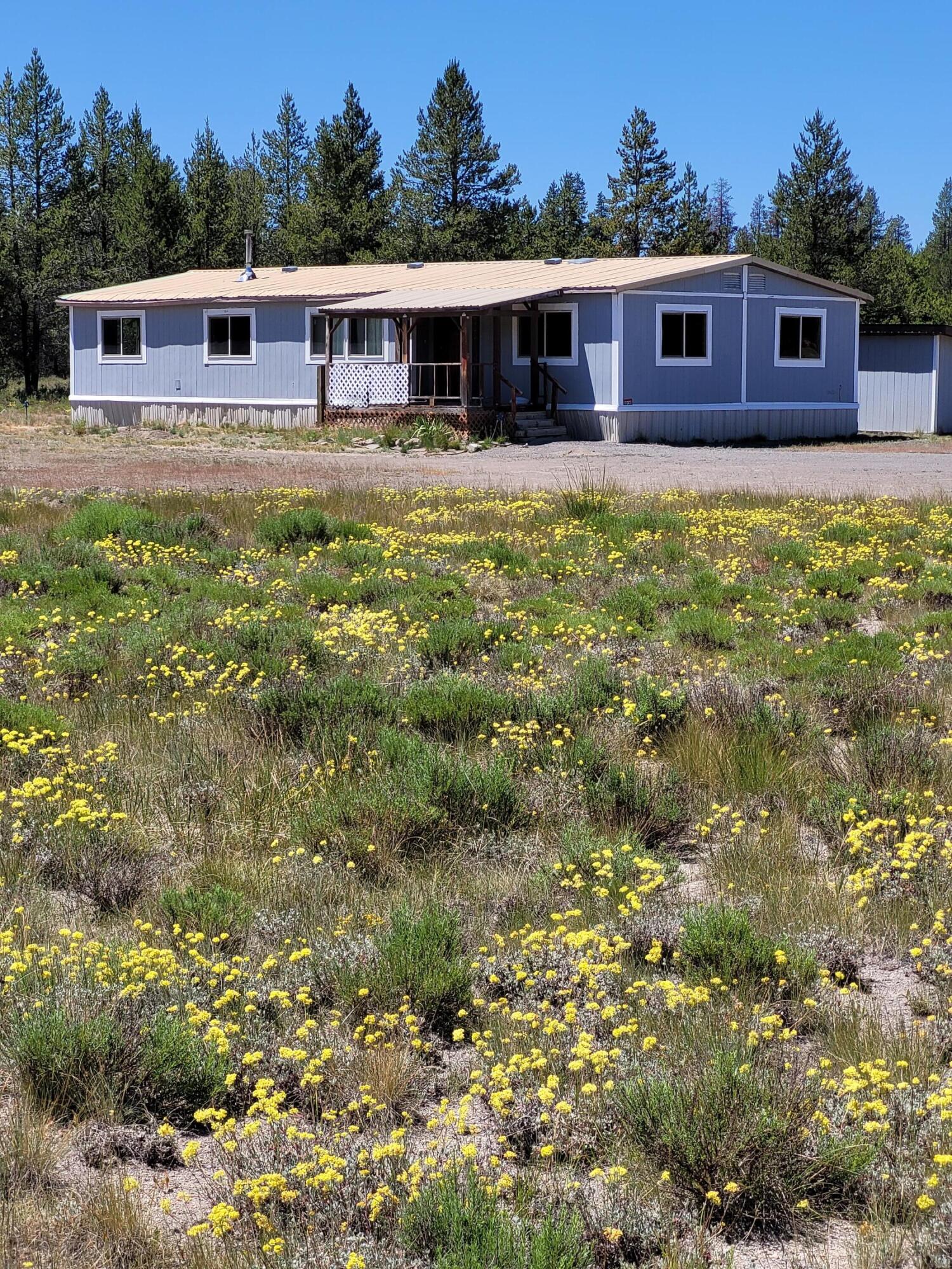 Acreage!!! This manufactured home sits on nearly 6 acres. It is only a few short miles from Diamond Lake and all of the recreational activities from horse back riding, snowmobiling, inner-tubing, skiing and hiking. Close to schools and shopping. This property is being sold ''AS-IS'' and offers owner terms!